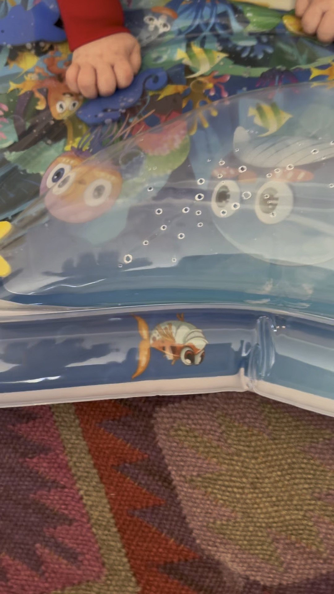 Tummy time activity under water mat. 