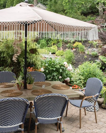 Our exact blue and white French bistro chairs from Target aren’t available anymore but any of the patio chairs linked would look just as good with any patio table. Loving the fringe patio umbrella with the combo too | #outdoorliving #outdoordining #patiodecor

#LTKhome #LTKSeasonal #LTKstyletip