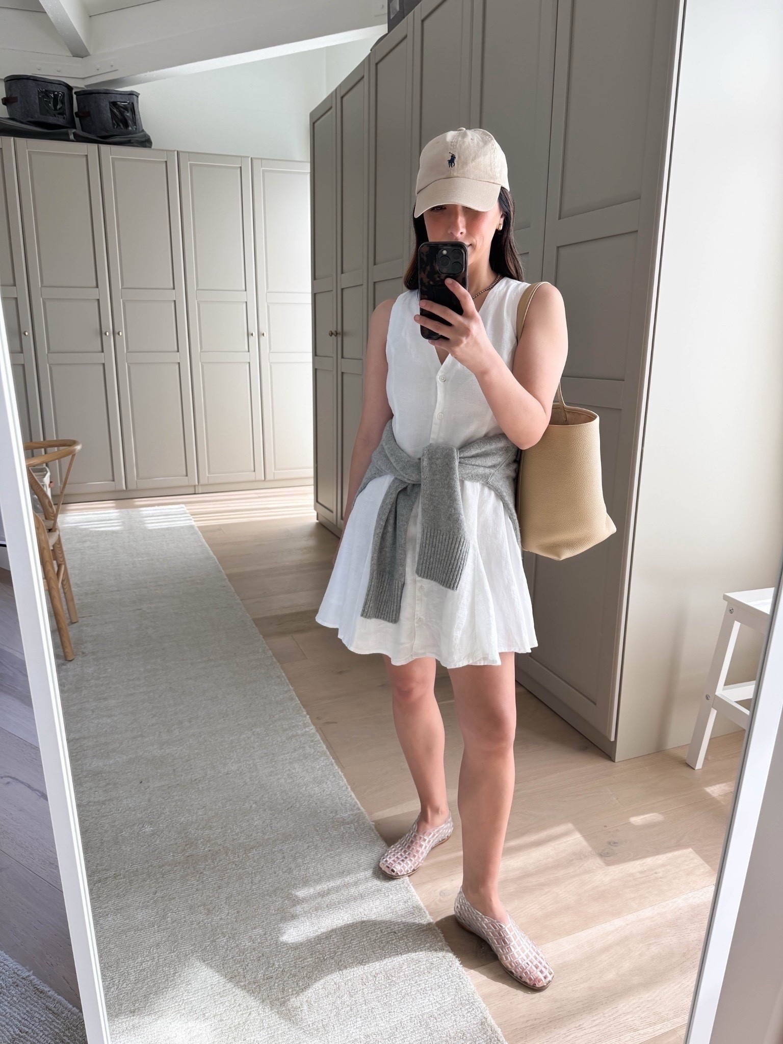 Elevated spring outfit with a little white dress. On sale!

J.Crew dress petite 2 - size up if you have boobs
Everlane boxy cashmere sweater xs
Amazon jelly flats 5
Polo Ralph Lauren hat
The Row Park tote in medium
Quince earrings
Dorsey James necklace15"

Dresses, white dress, spring dress, petite style, spring outfits 2026,

#LTKootd