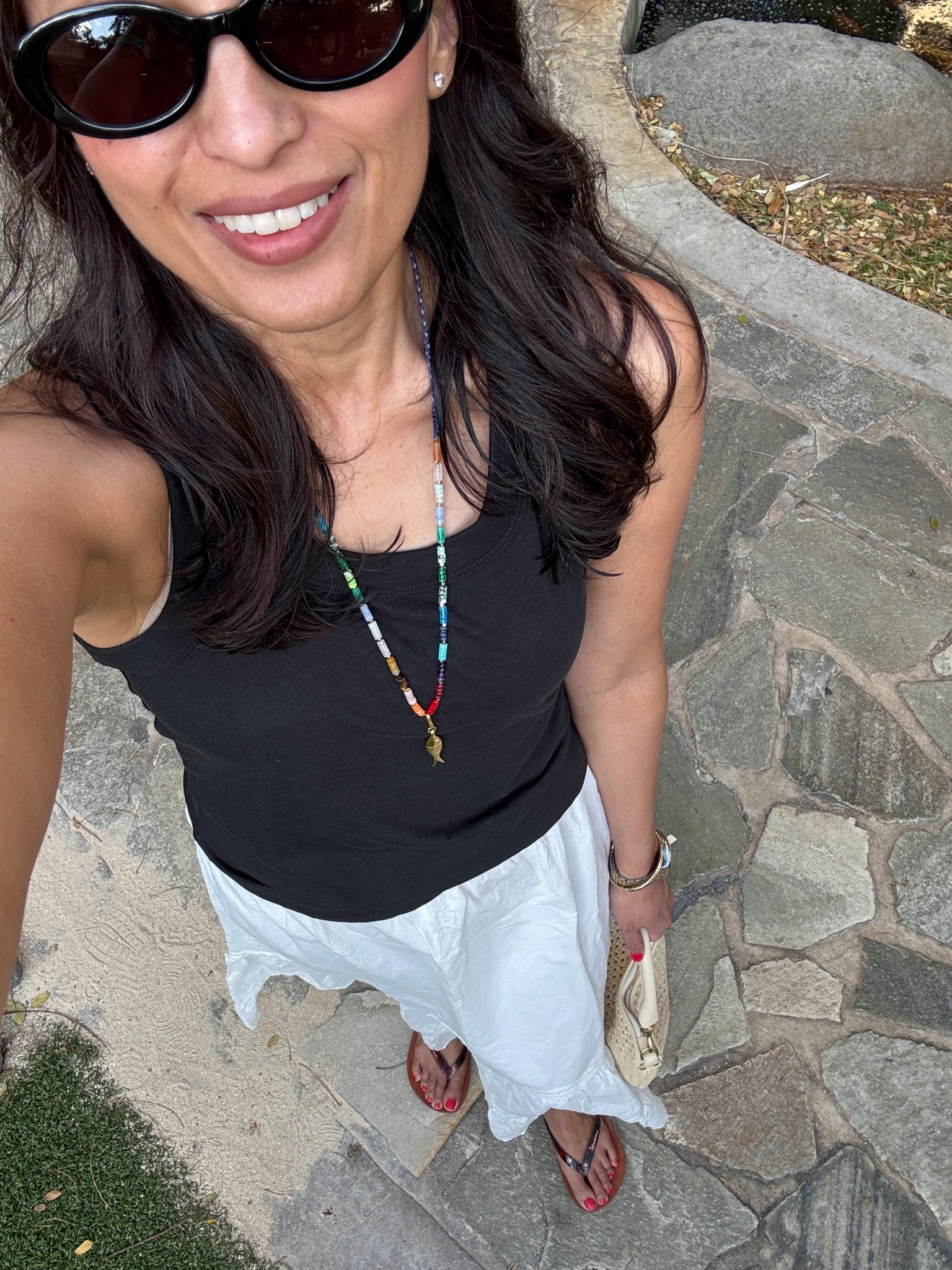 Vacation outfit. Spring break. 
White skirt is all cotton with embroidered details. Elastic waist with drawstring. Lined. True to size. 
Black cotton tank top. True to size. 
Woven handbag. 
Comfy flip flops. True to size. 


#LTKFestival #LTKOver40 #LTKTravel