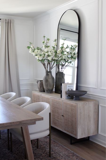 Dining room styling, neutral decor, spring decor, spring floral stems, Walmart home decor, favorite sideboard, arched mirror, vases, dining table, dining chairs, rug, virtual Amazon curtains, curtain rod, pottery barn home decor 

#LTKSeasonal #LTKhome #LTKstyletip