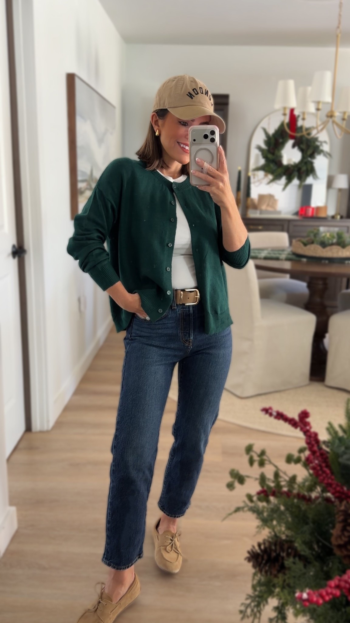 Tops: in a small in both 
Jeans: in a 25x26 but need a 25x28 (im 5’2)
Shoes true to size 


✨ Casual holiday outfit inspo for everyday style lovers 🤍 This classic green cardigan paired with high-rise denim, a neutral baseball cap, and suede loafers is the perfect mix of cozy, chic, and effortless. A timeless winter wardrobe essential you can dress up or down for festive gatherings, school drop-off, or weekend errands.

Green cardigans are trending this season and this one is such a versatile layering piece for winter outfits, holiday style, and elevated basics. 🍃✨

#holidayoutfit #winteroutfitideas #everydaystyle #casualstyle #greencardigan #wardrobeessentials #outfitinspo #winterfashion #holidaystyle #capsulewardrobe #neutralstyle #momstyle #fashioninspo

#LTKootd #LTKdayinmylife #LTKPetite