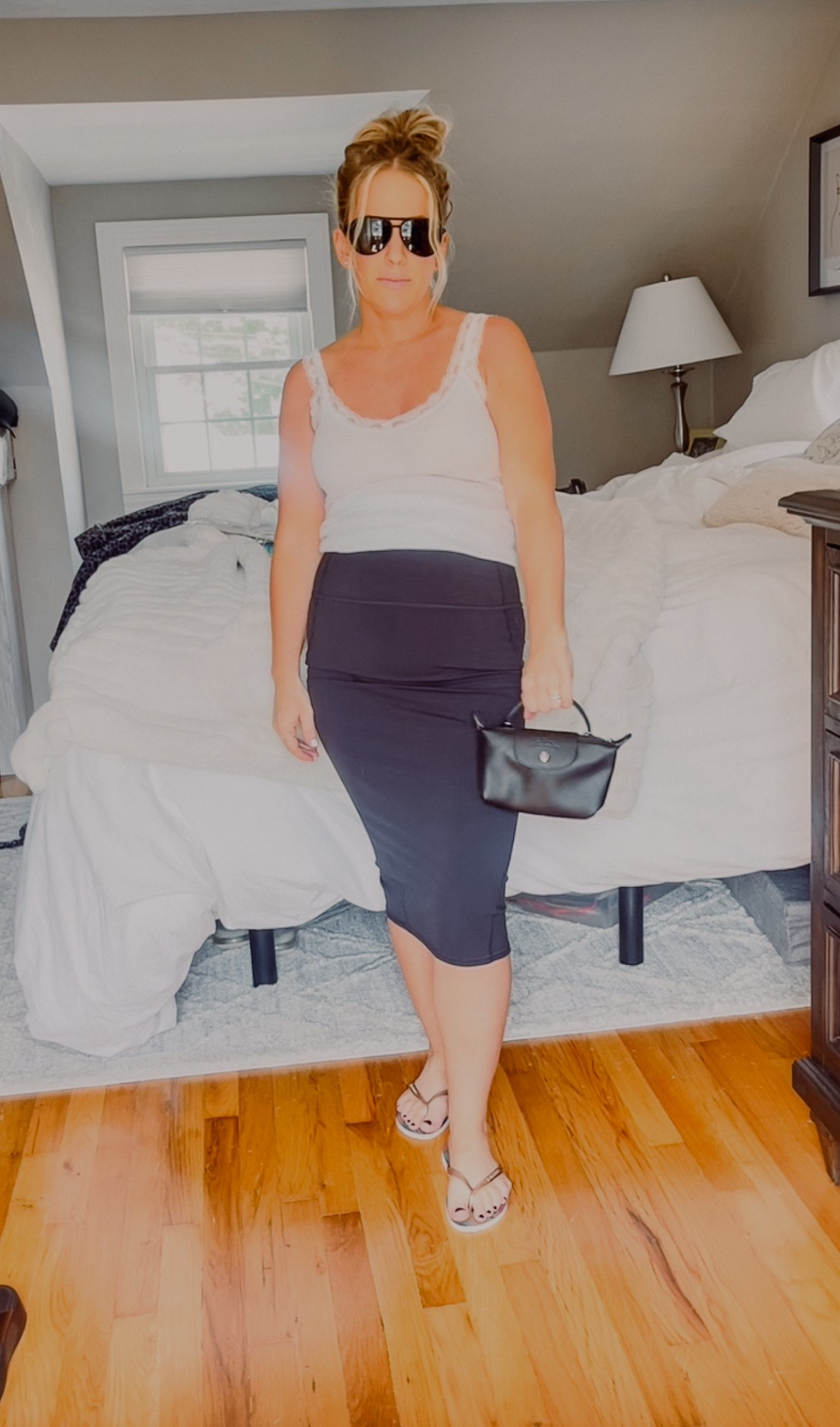 Lululemon midi pencil skirt 
Nulu slim fit high rise- also comes in an updated maxi length! Normally a 4-wearing a 6 comfortably 6 months pregnant 
Havianas 
Longchamp mini 
Lacey tank 
Black aviators 


#LTKActive #LTKBump #LTKItBag