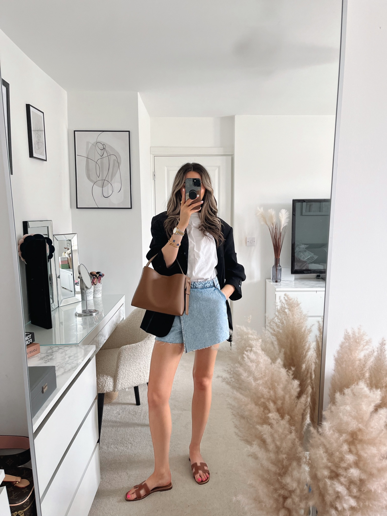Denim skort, oversized white T-shirt, black oversized blazer, tan bag & tan sandals. Summer outfit ideas. 

#LTKSeasonal #LTKeurope #LTKstyletip