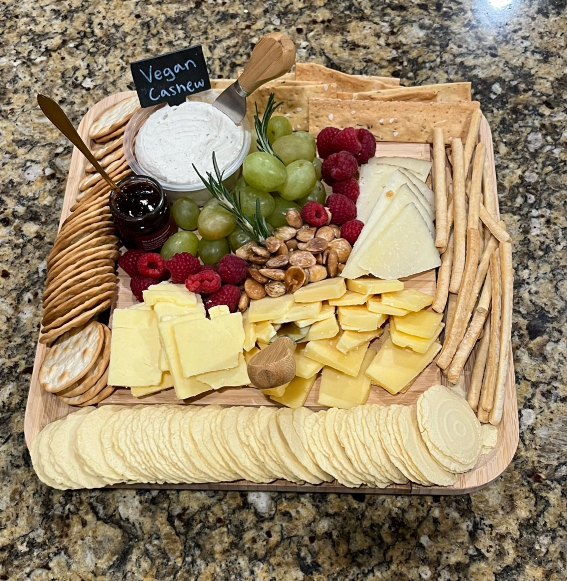 Best charcuterie/cheese board! 🧀 love the hidden tray with the little chalkboard signs and utensils that it comes with! Precutting the cheese is a good tip because people didn’t have to cut their own cheese. We had vegan friends coming, so I had a separate board with the meats on it! Really big hit for the night and the board was empty!!😋 

#LTKparties #LTKHoliday #LTKCyberWeek