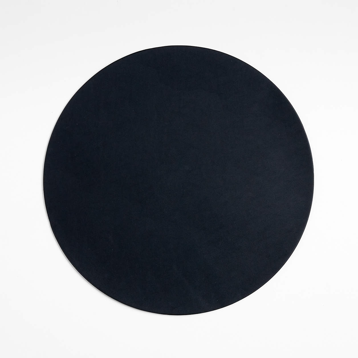 Rizzo Round Reversible Navy and Natural Faux Leather Placemat + Reviews | Crate & Barrel | Crate & Barrel