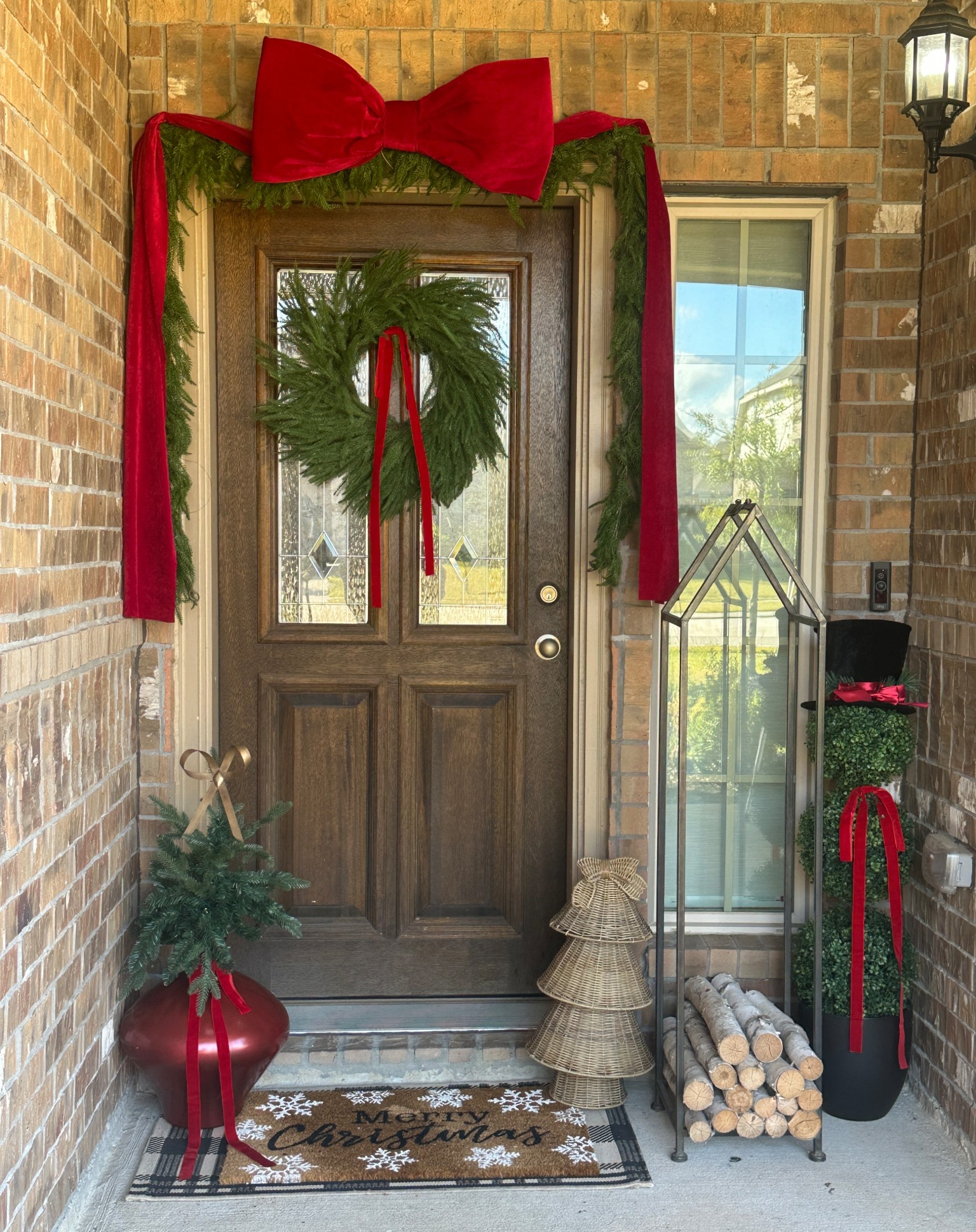 🎄✨ Classic Christmas porch decor but make it trendy — because the big velvet bow trend had to make an entrance! ❤️🎀 I went for a traditional look with fresh greens, warm textures, and timeless red accents.
In this post you’ll see:
– The cutest topiary snowman ☃️
– My DIY ornament vase with mini tree 🎄
– Rattan Christmas tree accent 🫶
– Norfolk pine wreath & matching garland 🌿
– And of course… the oversized velvet red bow stealing the show 🎀

#LTKHoliday #LTKHome #LTKSeasonal