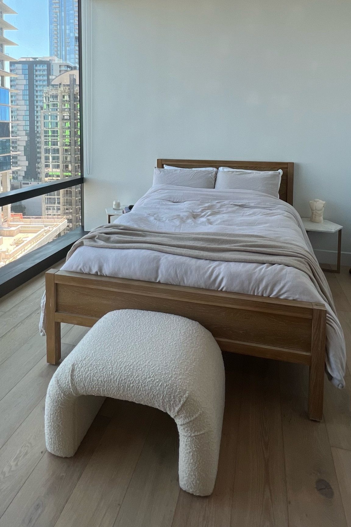 keeping the bedroom cozy and minimal with a natural wood colored bed, linen bedding, and marble end tables.

All elements from West Elm! 

#LTKhome