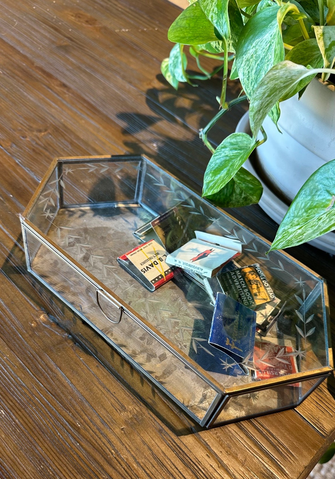 Love this vintage glass and metal trinket box. Such a versatile way to display jewelry, photos or collections like matches. I love the casket coffin-like shape, beveled glass panels, a mirrored bottom, and etched details which make it feel vintage! #interiordesign #styling 

#LTKStyleTip #LTKFindsUnder50 #LTKHome