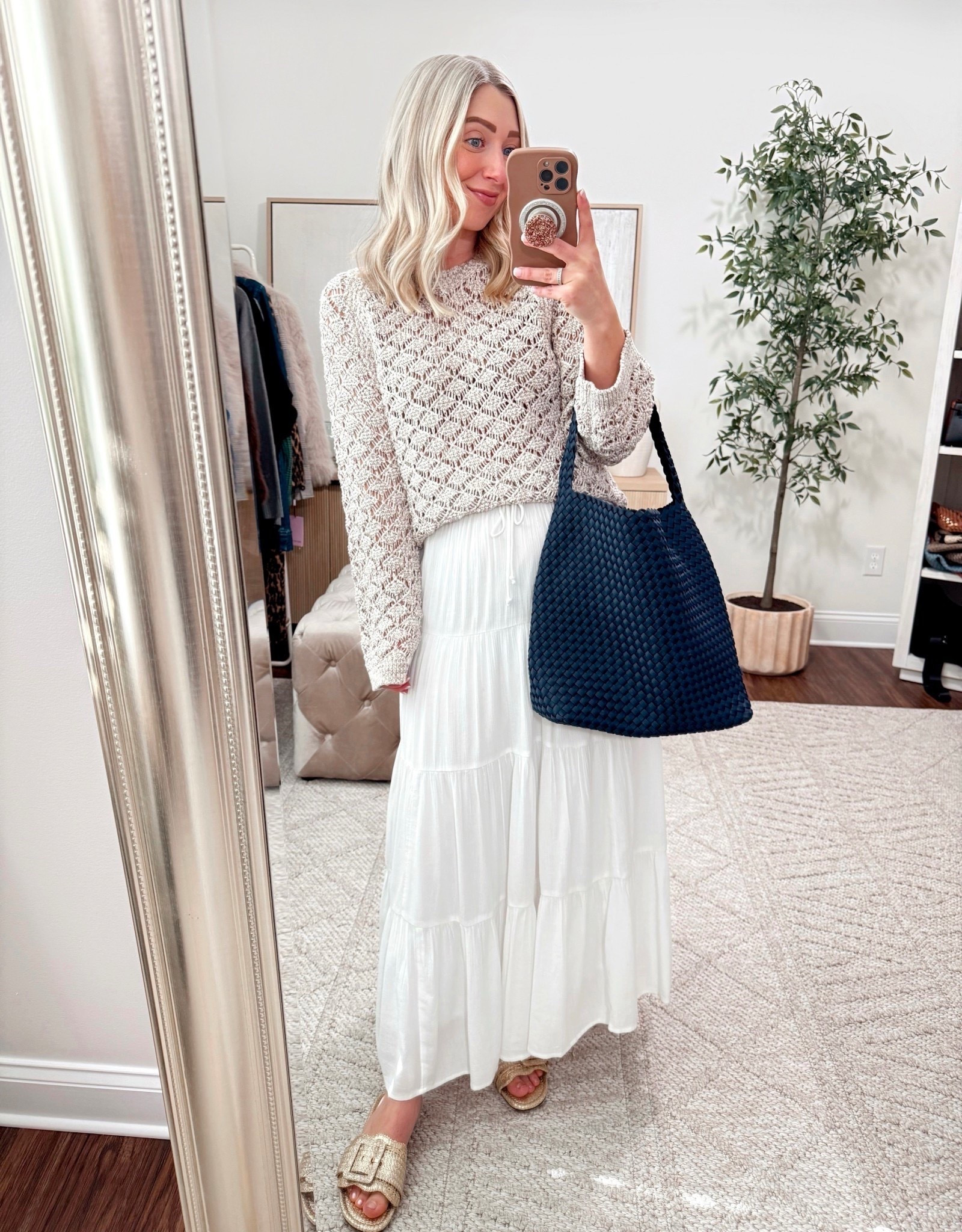 Early spring outfit Inspo for when we get out of these snowy cold temps! 😜 This sweater looks like seashells and will be on repeat come Spring and Summer! 🐚 🩷 Shop everything via the 🔗 in my bio!

Size small sweater, similar skirt linked, sandals tts, bag is navy 

#LTKgrwm #LTKootd #LTKmomlife