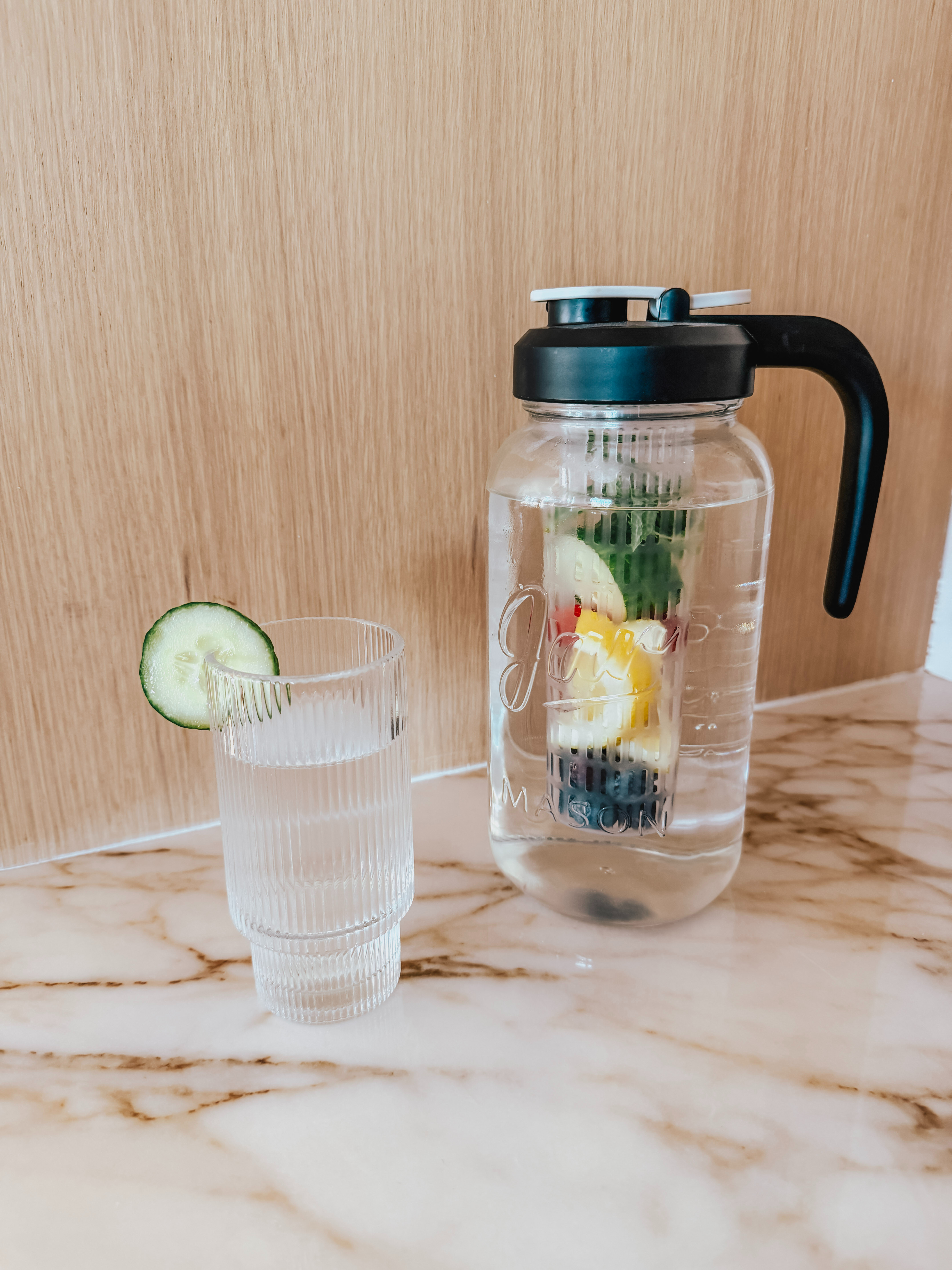 This glass mason jar water pitcher with an infuser is a summer must have. The result is a clean, easy-to-pour beverage with the flavor of the infused ingredients but without loose fruit or herbs falling into the glass. 

 #LTKHome
