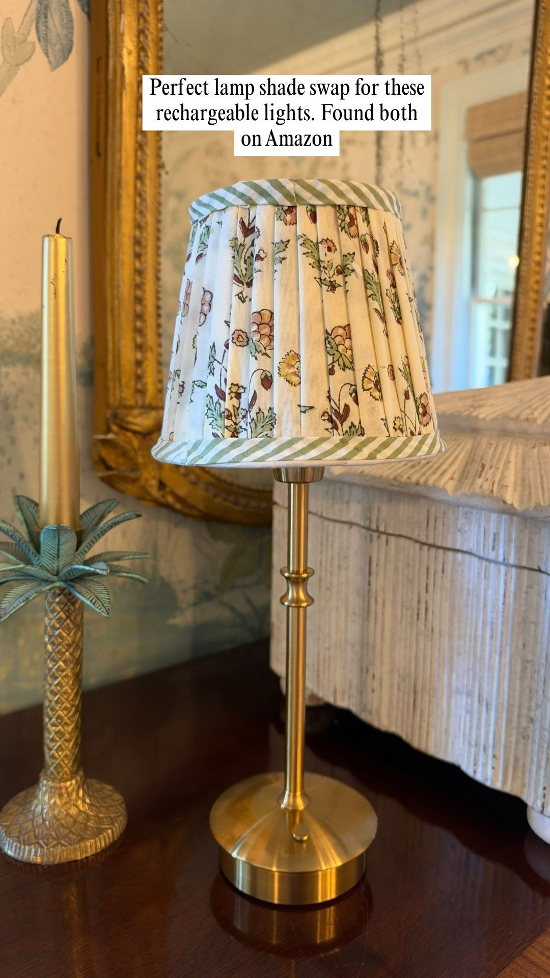 Sometimes the smallest thing on a sideboard ends up being the one that makes the whole corner feel finished. 🕯️

I kept the overhead light off one evening and just turned this little lamp on, and the room instantly felt warmer and cozier. It's a slim brass lamp with a pleated floral shade and a soft green striped trim, and it sits so nicely next to my gold mirror and candlesticks. It adds a glow without taking over the space. ✨

A lot of you ask about the details in my home, so I linked the lamp and a few of the pieces around it. Tap the link to take a look. 👇 

 #LTKHome #LTKSaleAlert
