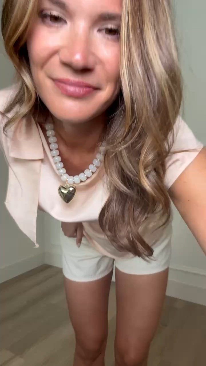 This satin drape neck top looks so much more expensive than it is. The soft blush color, elegant neckline, and easy fit make it perfect for summer dinners, date nights, and dressier occasions without sacrificing comfort.

satin top, drape neck blouse, blush pink top, summer outfit, white shorts, date night outfit, elevated basics, chic style, affordable fashion, vacation outfit, dressy casual look, summer wardrobe, StangandCo

#LTKootd #LTKTall #LTKSeasonal