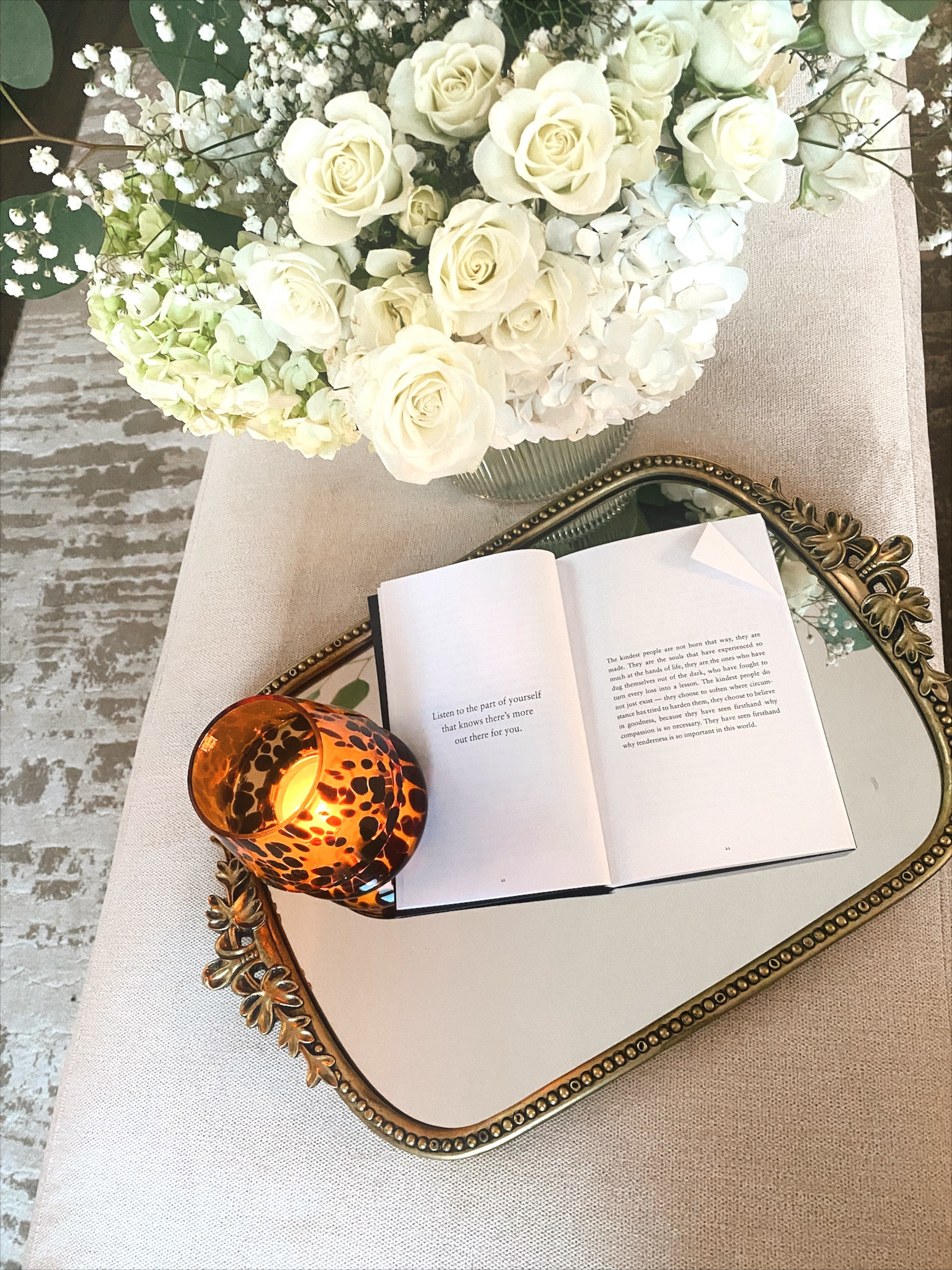 Coffee table tray
A gentle reminder book 🤍
-
Anthropologie primrose mirror, vanity tray, candle, book, home decor