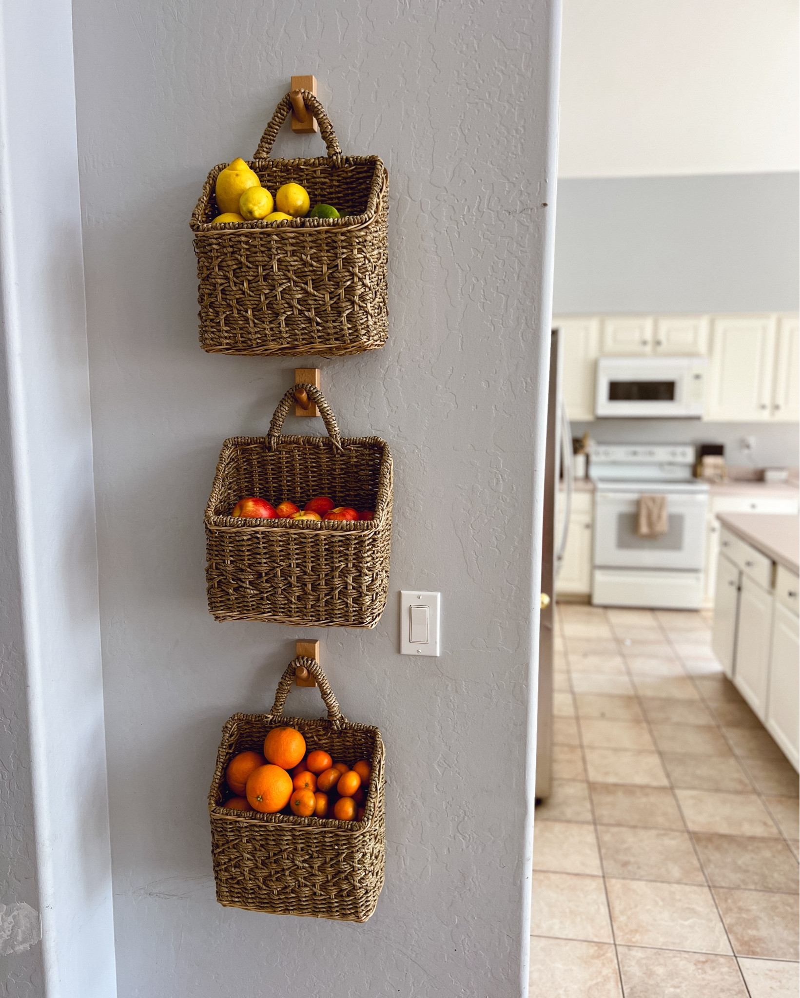 $15 Fruit baskets to clean up my counter tops! You can use these in so many spaces, it works perfect on this wall. My kids can grab fruit and my counters stay tidy…. Well tidier 😂 

I line mine with parchment paper and add a cinnamon stick to keep the mess and bugs away!

#LTKFindsUnder50 #LTKHome #LTKStyleTip