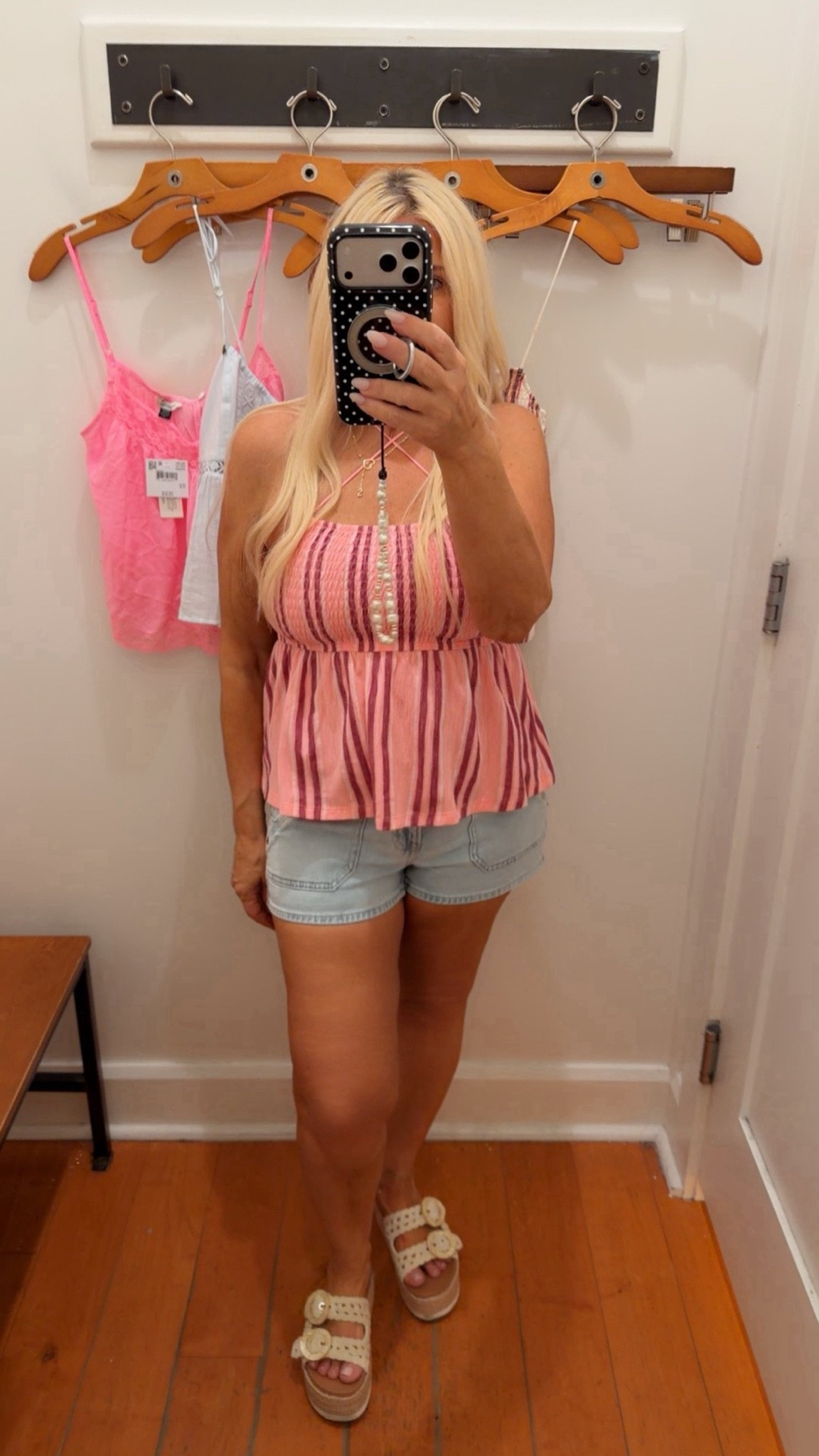 Pink babydoll top styled with low rise denim shorts for a cute feminine summer outfit. Easy casual look perfect for shopping days, vacations, concerts and hot weather outfits.

#LTKPetite #LTKSeasonal #LTKootd