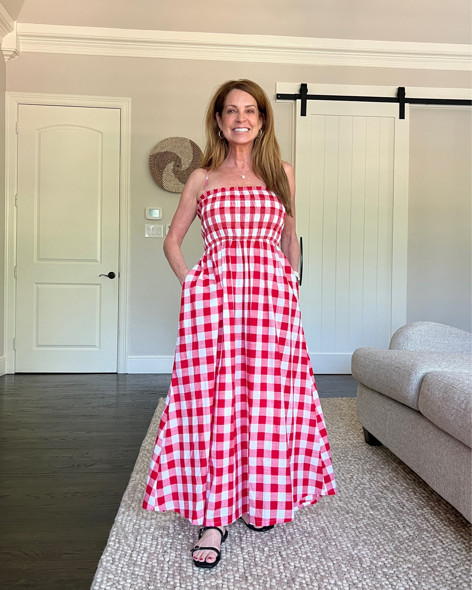 A fun red and white gingham sundress. I love wearing it as is or with a jean jacket as a topper moving into the cooler months ahead. It's a great option for all of the patriotic holidays. Note that the skirt is pretty full. I'm wearing a regular size 4 for more of a maxi dress look.
#transitionaloutfit #redandwhite #womenover50 #midlifestyle

#LTKFindsUnder50 #LTKSeasonal #LTKStyleTip