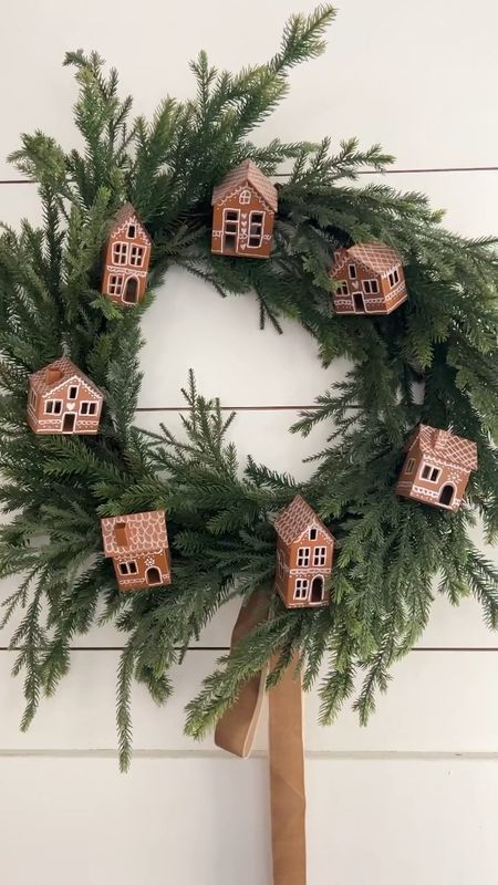 Make a DIY gingerbread house wreath. Just spray paint galvanized houses, add designs with a paint pen and attach the houses to your wreath by hot gluing pipe cleaners to the backs of the houses. I have all of the house design pictures on this post https://tatertotsandjello.com/painted-gingerbread-houses-holiday-wreath/ ❤️

#LTKSeasonal #LTKVideo #LTKHoliday