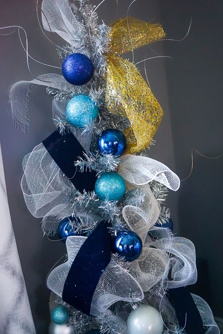 My tinsel tree is a fun catch all with ornaments and decor left over from other trees. I love how the colors pop against the silver! 

#LTKhome #LTKHoliday #LTKSeasonal