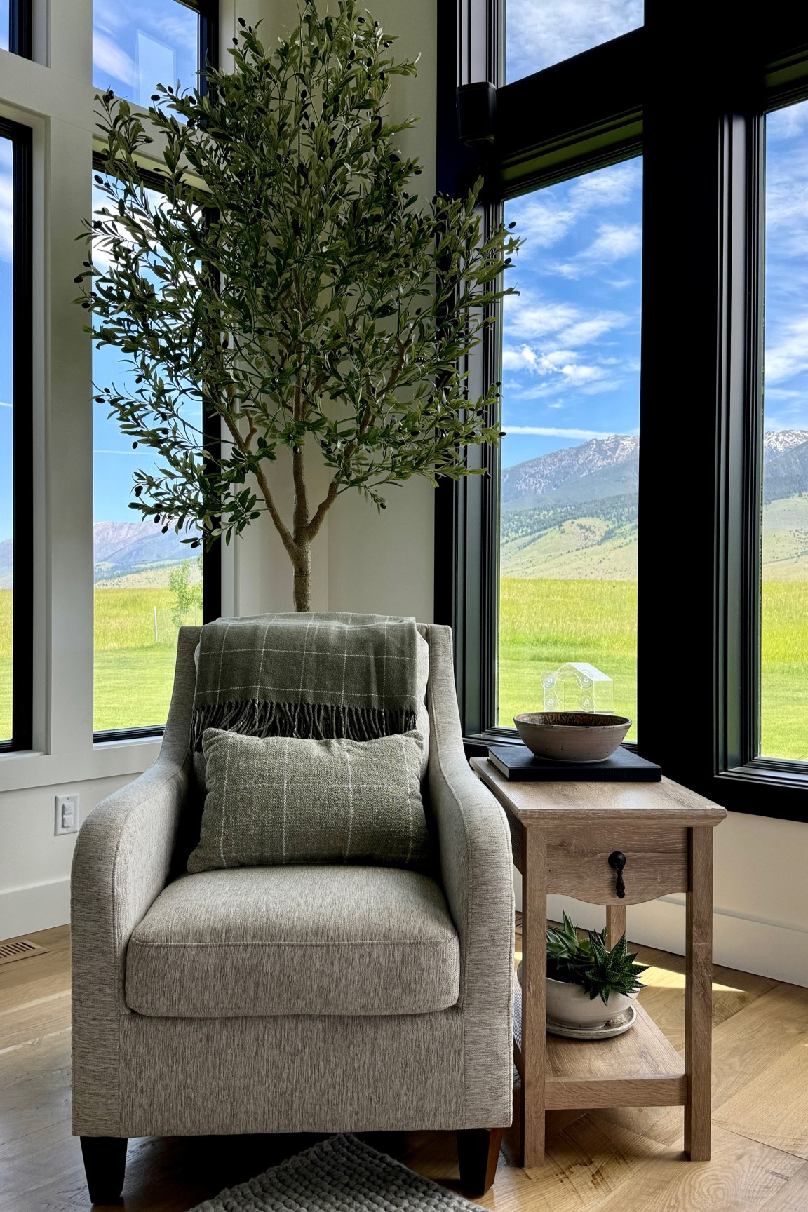Loving this new living room corner with our new 10 foot olive tree and Accent chair!

Huge indoor olive tree 
10 foot faux olive tree 
Accent table
Side table
Accent chair
Comfortable sitting here
Throw pillow
Wool throw blanket
Pottery bowl


#LTKHome