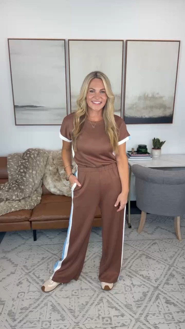 This chocolate brown set has the sporty details I love without feeling like workout clothes. The blue and white side stripes make it such a fun option for travel days, errands, or a casual office day.

matching set, brown matching set, wide leg pants, travel outfit, casual fall outfit, sporty style, comfortable outfit, fall travel style, everyday outfit, two piece set, AudrieDollins

#LTKootd #LTKSeasonal #LTKOver40