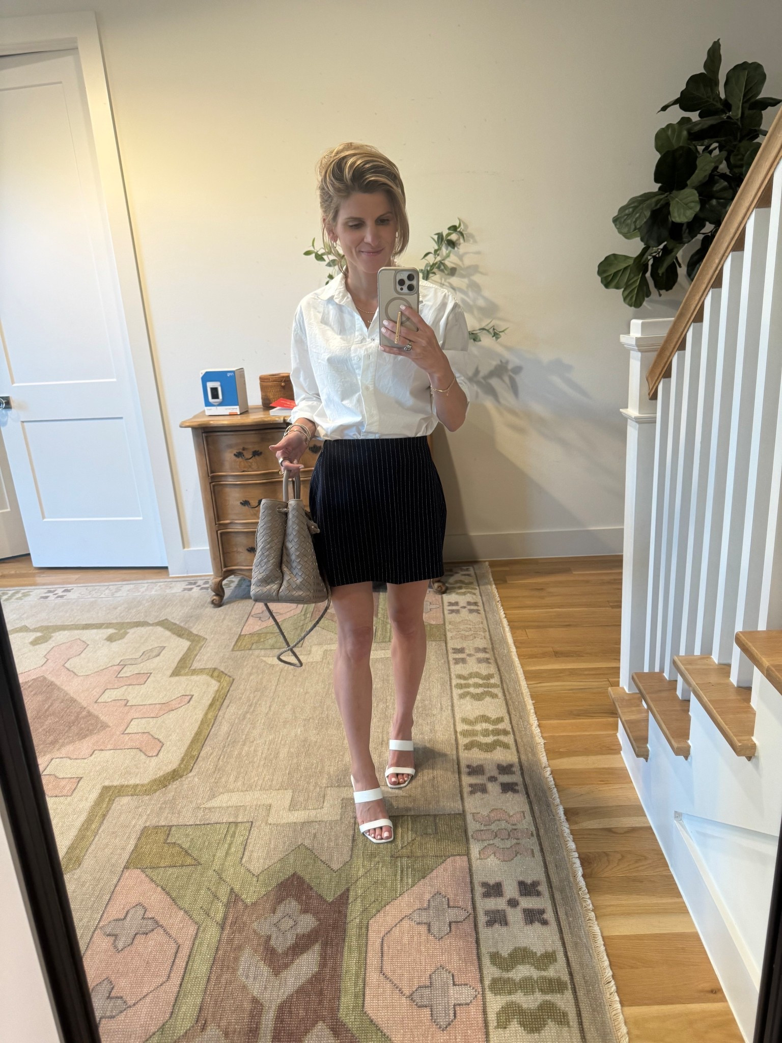 Pinstripe Skort - Abercrombie (size XS)
Button up white top - Julia Amory
Woven bag - quince 
Shoes - old Schutz 