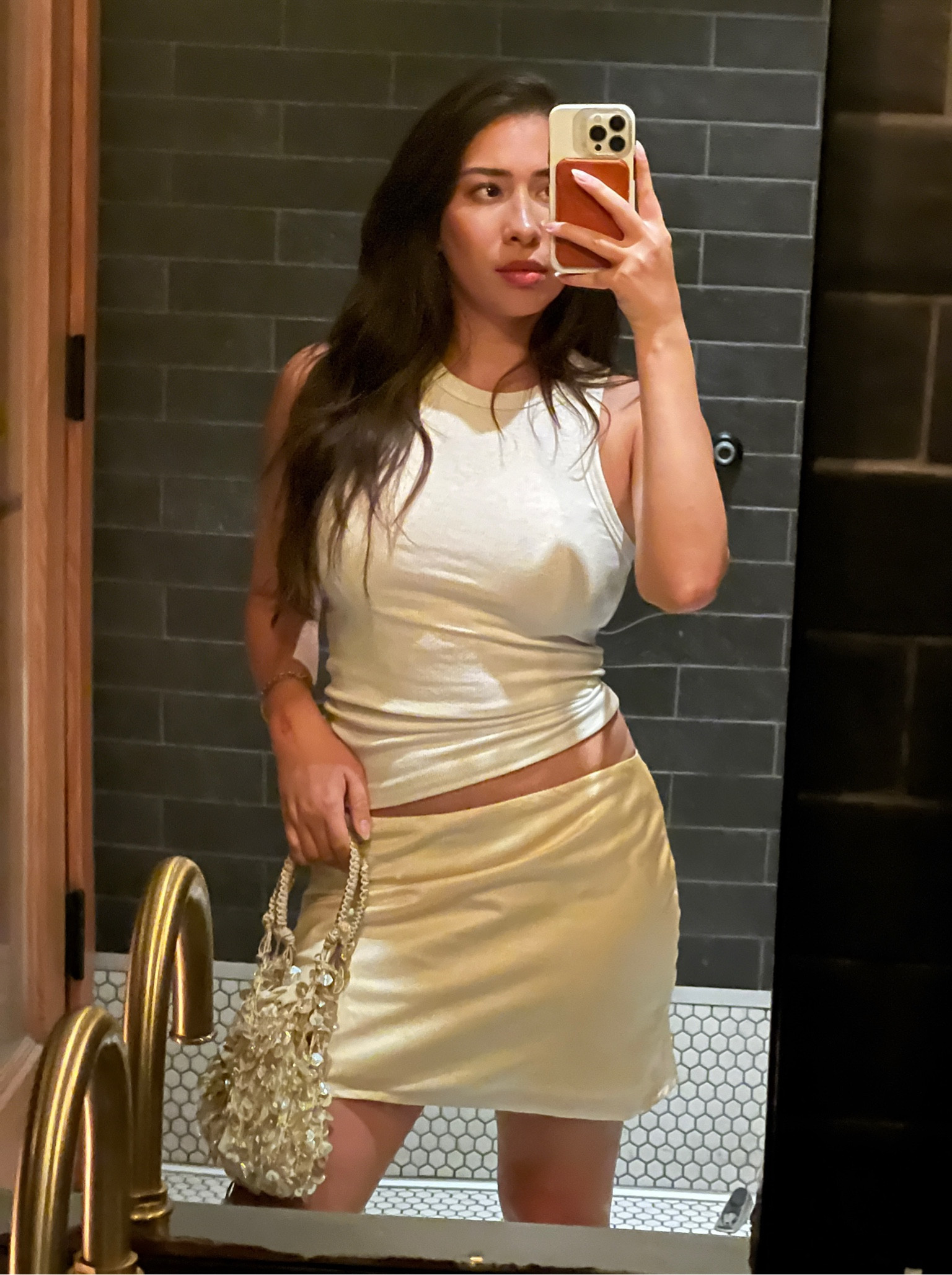 Summer night out outfit. Colorful mini skirt, simple white tank and a cute bag