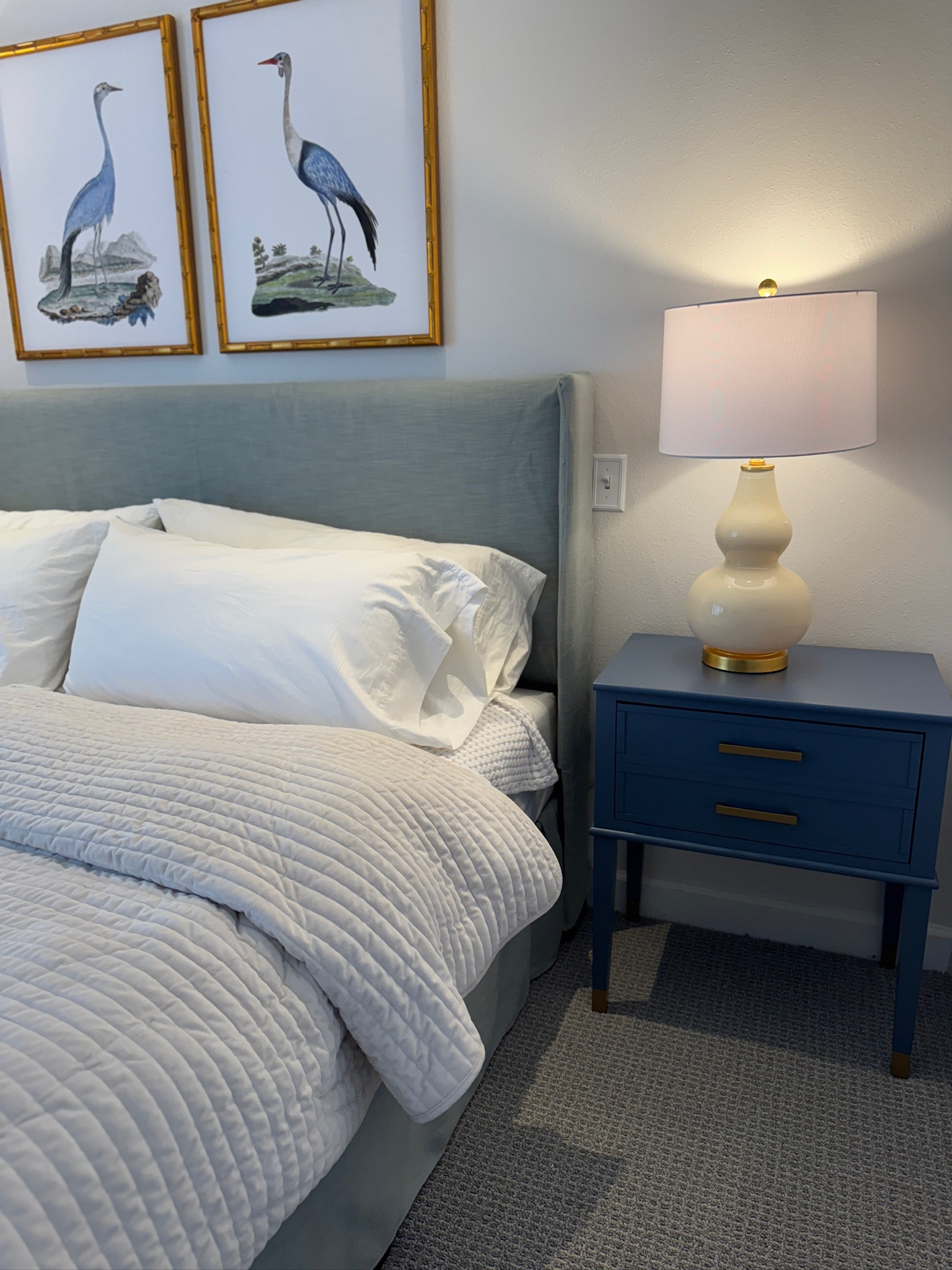 decor and furniture in our condo airbnb! Love these prints, lamp, and side table. upholstered bed, classic style, grandmillennial style, classic home, blue and white home, amazon home finds 

 #LTKHome