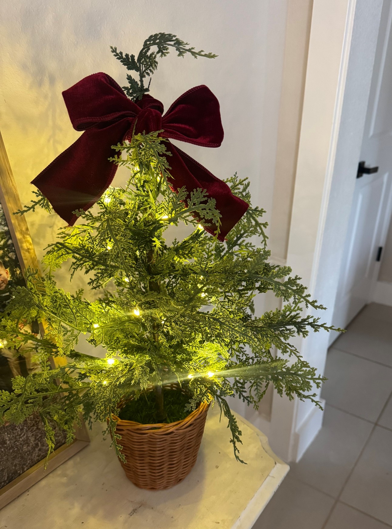 Caption (pretty + clean):
Little baby Christmas tree 🎄
24” Pre-Lit Cypress from My Texas House
Warm twinkle lights + burgundy velvet ribbon 🤍
So cozy for a small space.


#LTKSeasonal #LTKHoliday #LTKHome