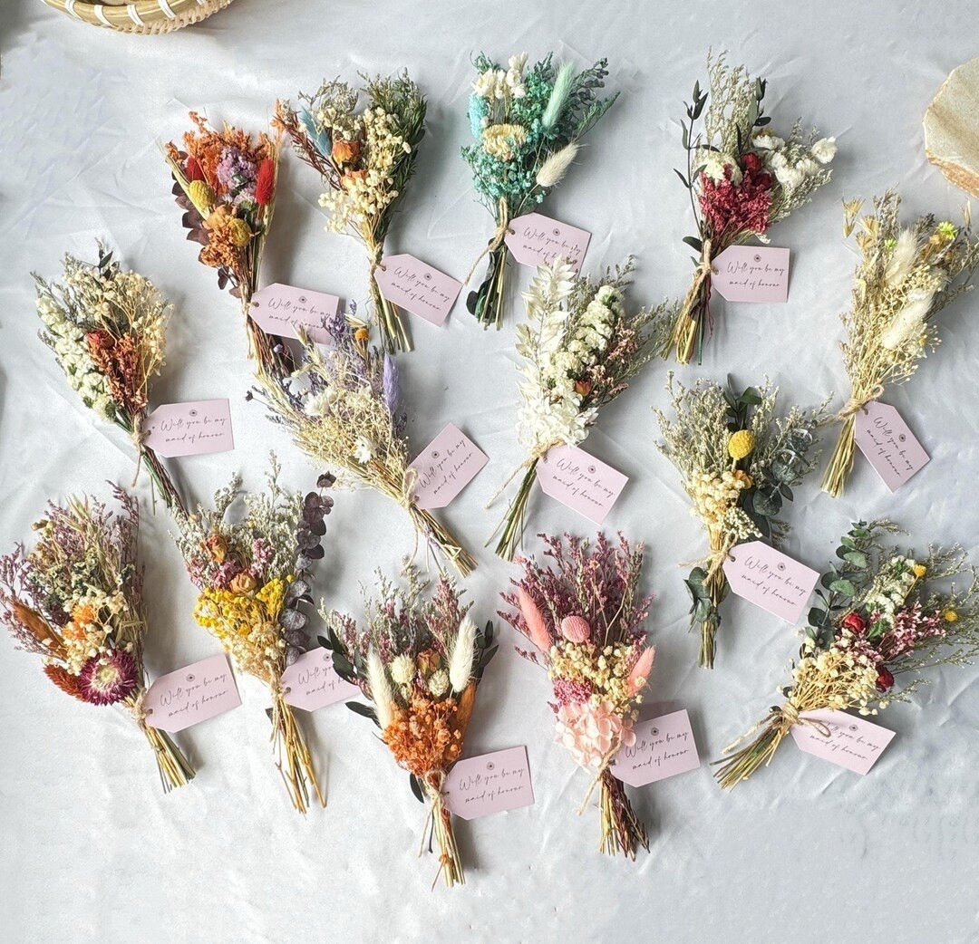 These boho mini dried flower bouquets from PurpleSmallbear are the sweetest little accents for gifting and decorating. Measuring about 6–8 inches long, each bouquet features a delicate mix of dried florals that feel effortlessly charming and versatile. Perfect for bridesmaid proposals, maid of honor gifts, vase styling, wall décor, or thoughtful occasions like housewarmings and birthdays. Thoughtfully shipped from New York, they’re a beautiful option that’s also kinder to the planet thanks to shorter shipping distances.

#LTKhome #DriedFlowers #MiniBouquet #BohoDecor #BridesmaidGifts #WeddingDetails #EcoFriendlyDecor #EtsyFinds #GiftIdeas

#LTKHome #LTKSeasonal #LTKWedding