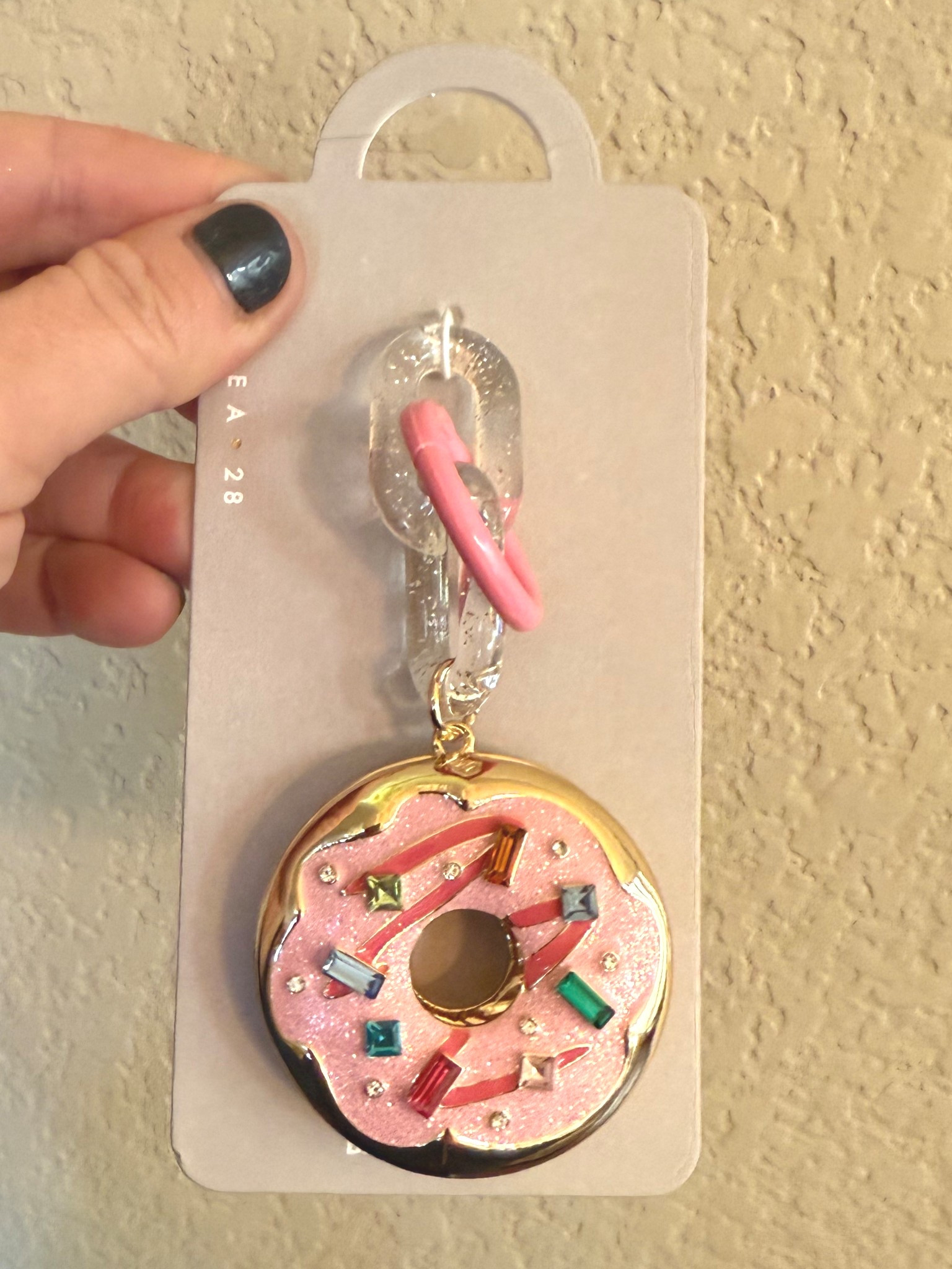 This bag charm is 100% my brand as a charm.  I mean “Diapers and Donuts” 💕 

The quality of this charm is so good!  It has been on my bag for a few weeks and I even with it getting knocked and dropped,  it still looks brand new! 