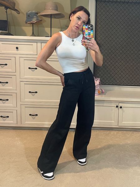 Can’t go wrong with a basic tank top and wide leg pants! Love this combination is black and white. Perfect for travel or just running errands. Wearing size 4 in shirt and pants. Size 7.5 in shoes. 

#LTKtravel #LTKstyletip #LTKover40