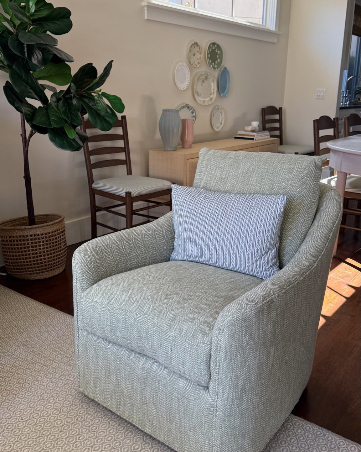Love an accent chair moment! Especially one that swivels.
Check out the full home makeover process on my YouTube channel!

home decor, living room makeover, coastal cottage aesthetic, coastal home decor, cottage style, coastal living room, neutral home decor, cozy living room, classic home decor, timeless interiors, relaxed coastal style, light and airy interiors, blue and green decor, blue and green living room, comfortable living room, traditional home decor, cottage living room, family room decor, coastal cottage, elegant home decor, layered neutrals, natural textures, classic coastal decor, living room inspiration, interior design inspiration, interior designer, green swivel chair, green accent chair, swivel chair, accent chair, blue couch, blue sofa, blue pleated couch,  blue pleated sofa, blue slipcover couch, blue slipcover sofa, slipcovered sofa, linen sofa, skirted sofa, coastal blue sofa, upholstered armchair, slipcovered armchair, coastal accent chair, wood coffee table, navy blue coffee table, dark blue coffee table, woven table lamp, decorative throw pillows, gallery wall, white fireplace mantel, brick fireplace, built-in shelving, open shelving decor, ceramic vases, coastal coffee table styling, decorative coffee table books

#LTKHome #LTKvlog #LTKdayinmylife