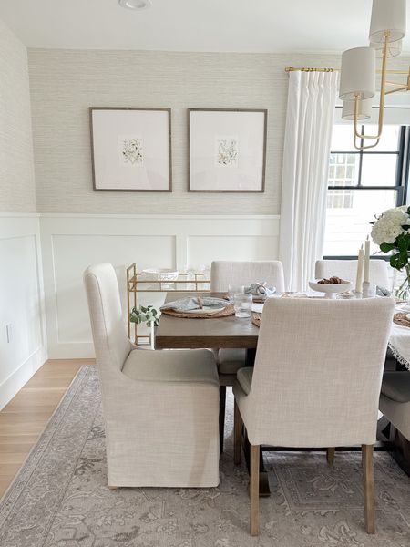 Dining room, gallery frame with floral print. Slipcovered chairs, upholstered chairs, dining furniture, grasscloth wallpaper 

#LTKhome #LTKstyletip #LTKsalealert