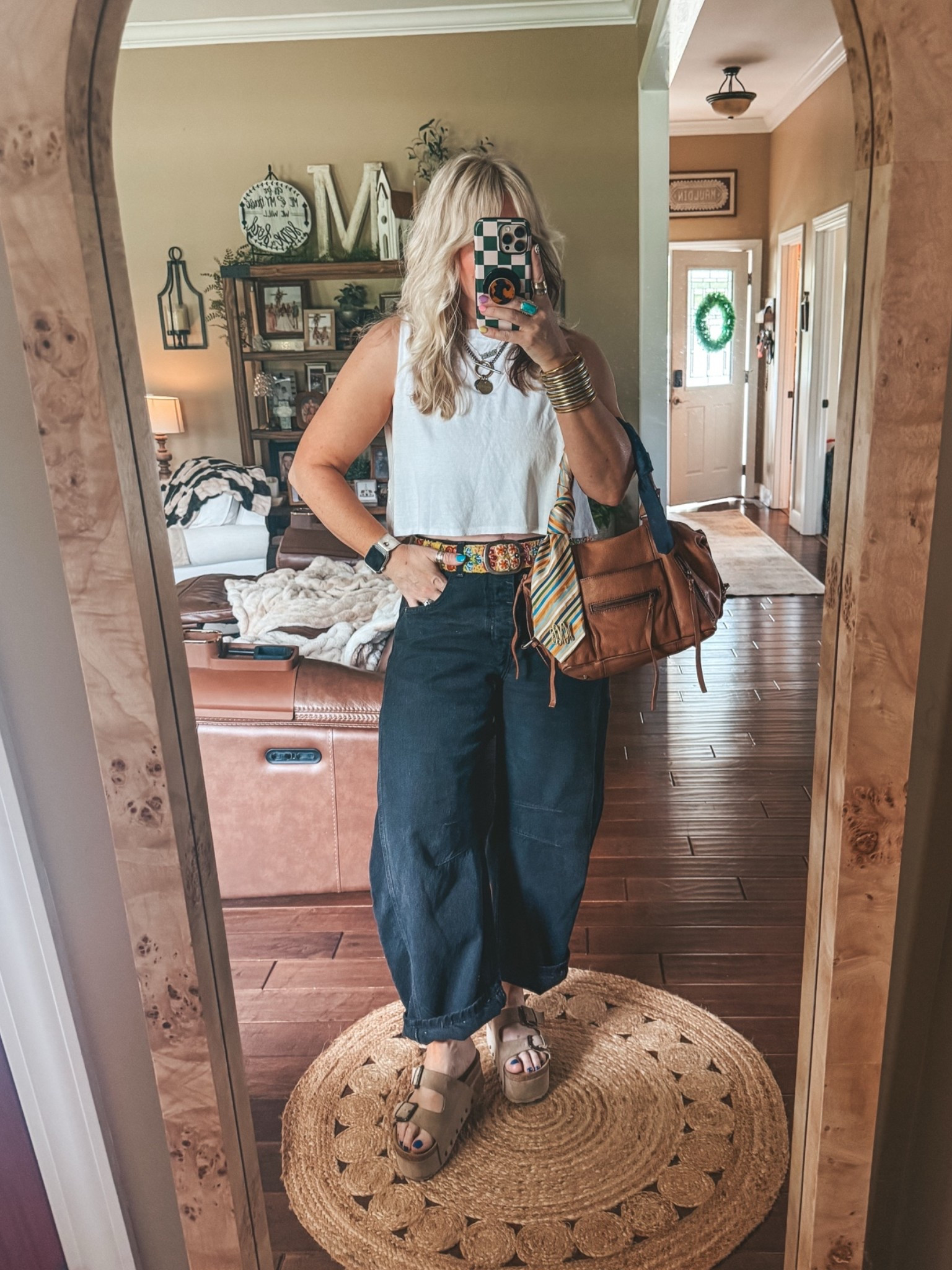Love this white crop. Hits right above belt and this belt is so good I babe in alot of colors. My jeans run true to size size since they are black. Sandals are true to size too. 
#springoutfit #freepeople #barreljeans #blackjeans

#LTKootd #LTKOver40