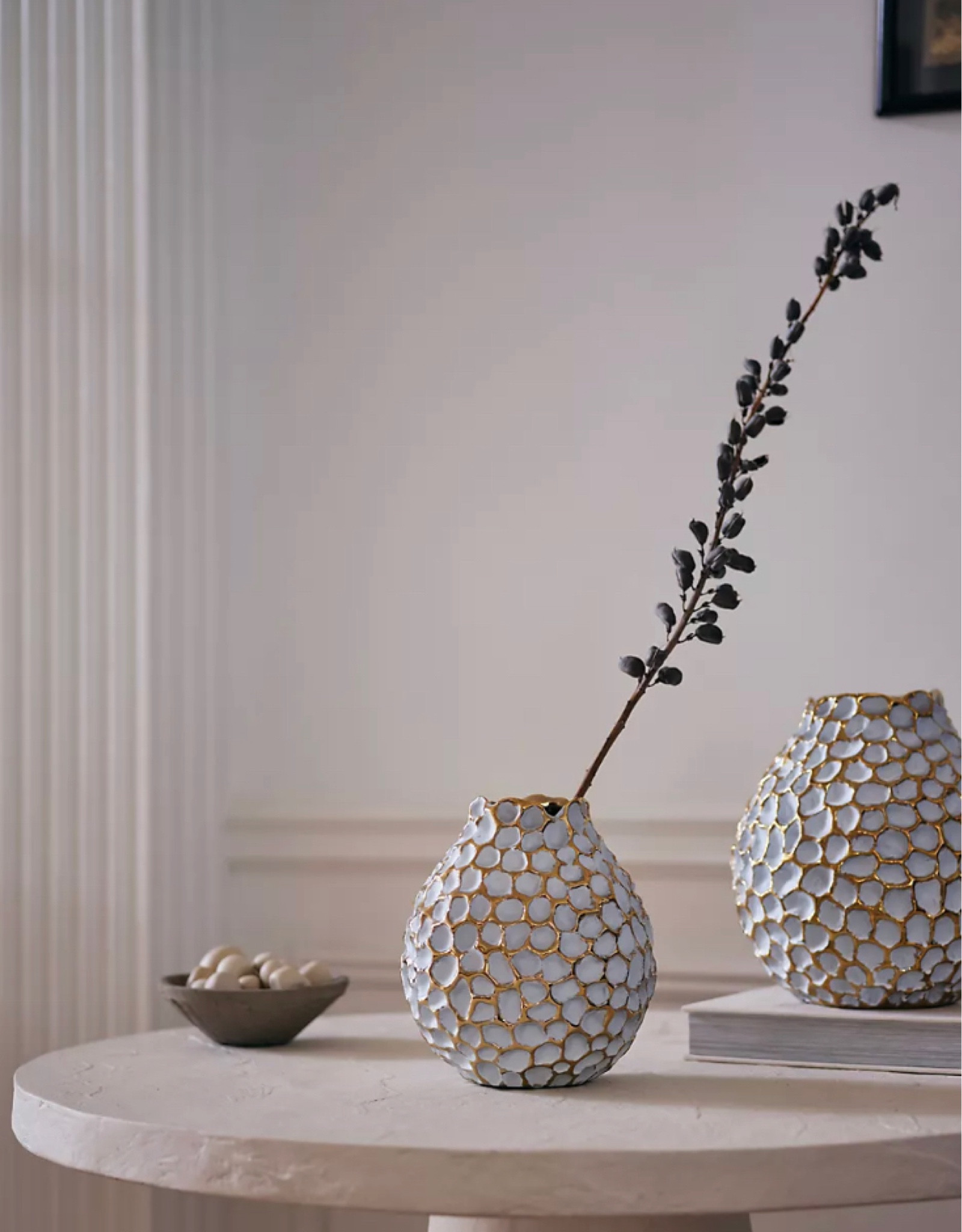 These gorgeous honeycomb accent vases with the most stunning gold texture / detail are on sale at Anthropologie! Must see up close! Neutral colors for any space. 

#LTKhome #LTKsalealert #LTKSale