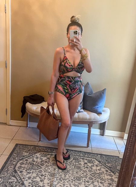 Walmart one piece swimsuit wearing sz M
Palm leaf
Black
Affordable 
Pool
Beach 
Lake 
Outfit
Idea
Naghedi st. Barths tote
Cocoa
Tory Burch flip flops
Summer
Vacation 
What to pack
Gold Budhagirl Bangles
Mom bathing suit
Cut out
Bottom full coverage 

#LTKshoecrush #LTKitbag #LTKswim