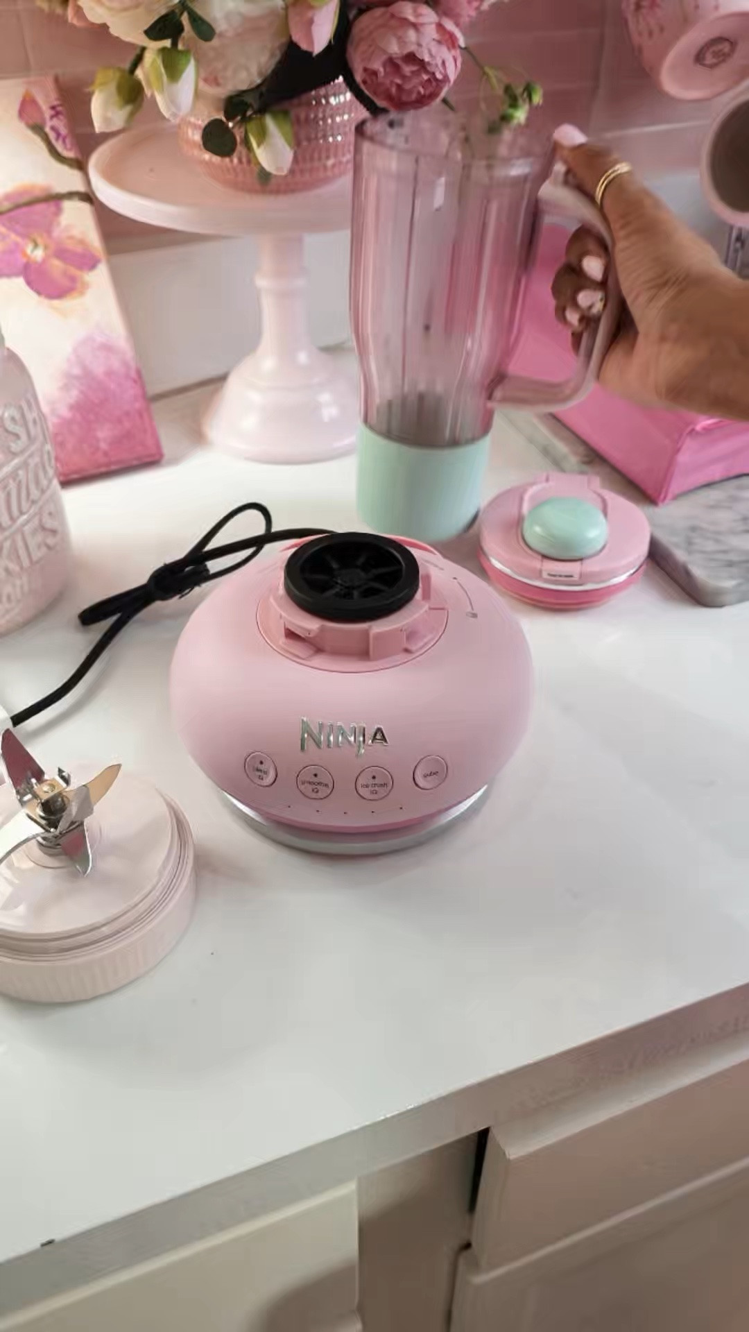 The pink Ninja BlendBOSS had absolutely no business being THIS cute and this powerful. 🎀🥤💕 It has a 1200-peak-watt motor, can crush ice, and the 26 oz version comes with a travel tumbler and leakproof sip/straw lid—so I can blend my smoothie and take the same cup with me. 

And you already know the moment Ninja made it PINK, it belonged in my kitchen. 😂💗 Cute countertop appliances that actually earn their space? Yes please.

#NinjaBlendBOSS #PinkBlender #NinjaKitchen #PinkKitchen #KitchenFinds
