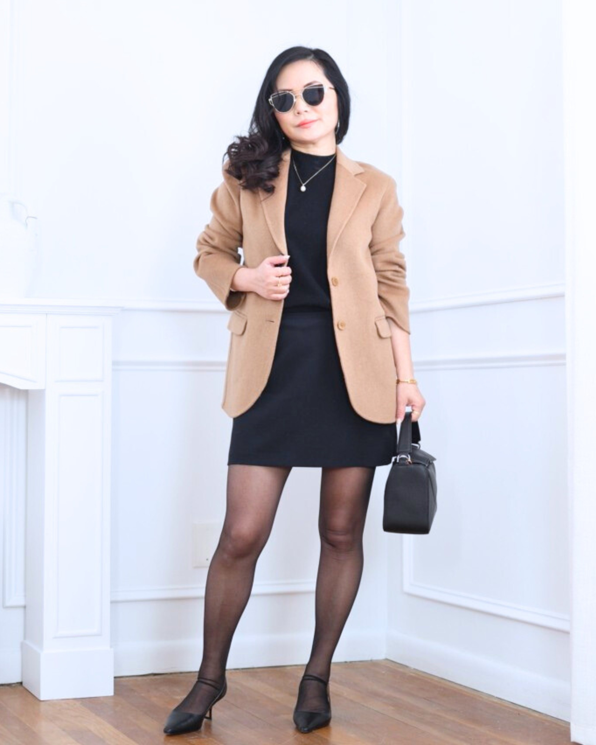 All-black base with a warm contrast — a mock neck sweater vest from Quince with an Abercrombie mini skort, tights, and slingback heels, finished with a caramel wool blazer from Quince for a polished, layered look. I’m 5’2, wearing size XS.

#LTKootd #LTKOver40 #LTKPetite