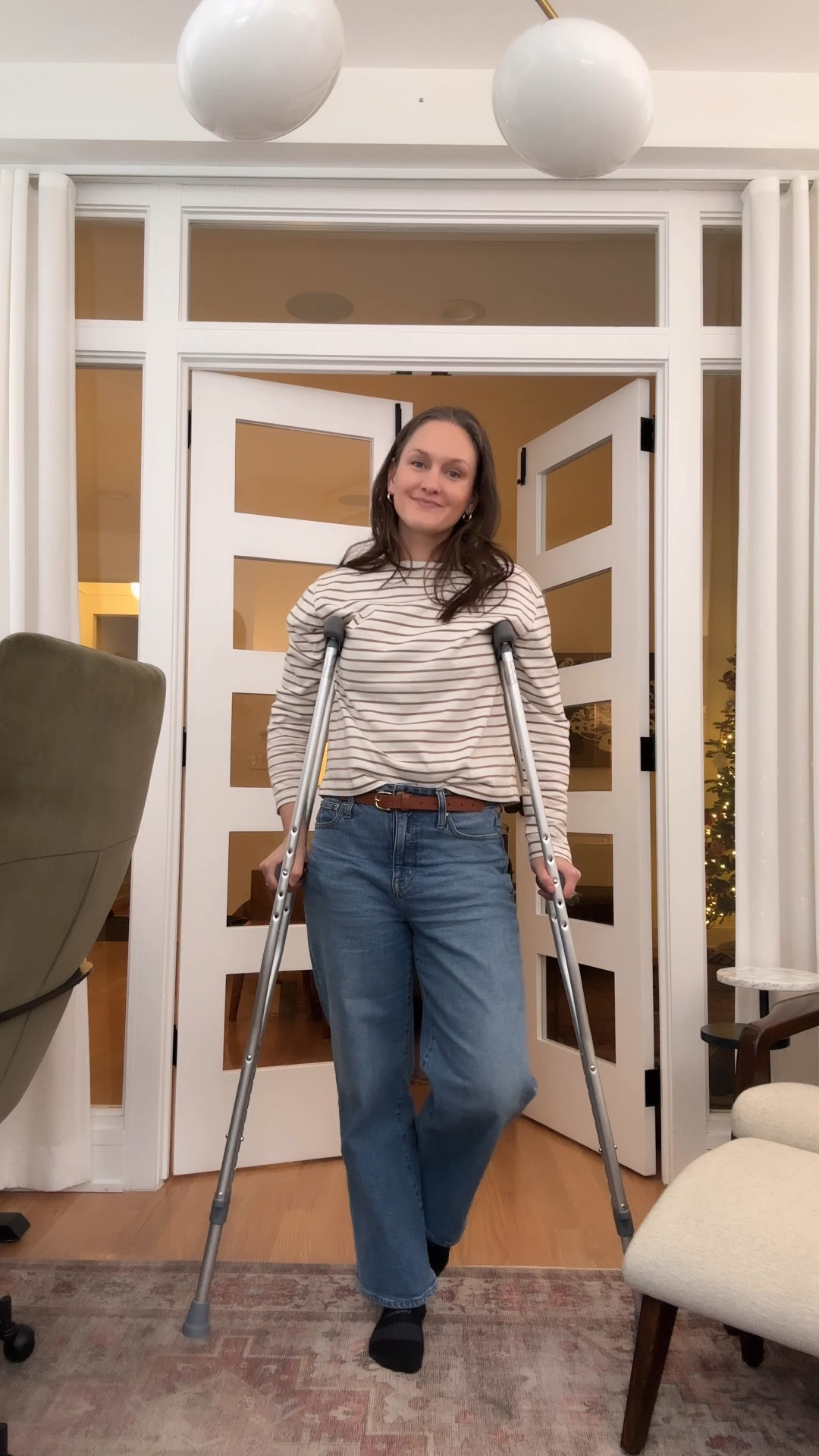 By Wednesday, she was clinging to her favorite tan-and-white striped shirt like a lifeline—a little sartorial sunshine to brighten a day that was veering off course. Her wide-legged jeans, accommodating the infamous ankle brace, paired effortlessly with her go-to gold hoops and necklace, whispering, you’ve got this. But the universe, armed with city construction, a snow-dusted parking drought, and the sheer chaos of toddler-wrangling, had other plans. Music class was a no-go; the thought of hobbling down slushy sidewalks on crutches while already running late was a romcom plotline she wasn’t ready to star in. Instead, she pivoted to a cozy stay-at-home day, determined to turn lemons into hot cocoa with marshmallows. And if her striped shirt could talk, it would agree: sometimes, the best music is toddler giggles echoing through your own living room.

#LTKWatchNow #LTKStyleTip #LTKFamily