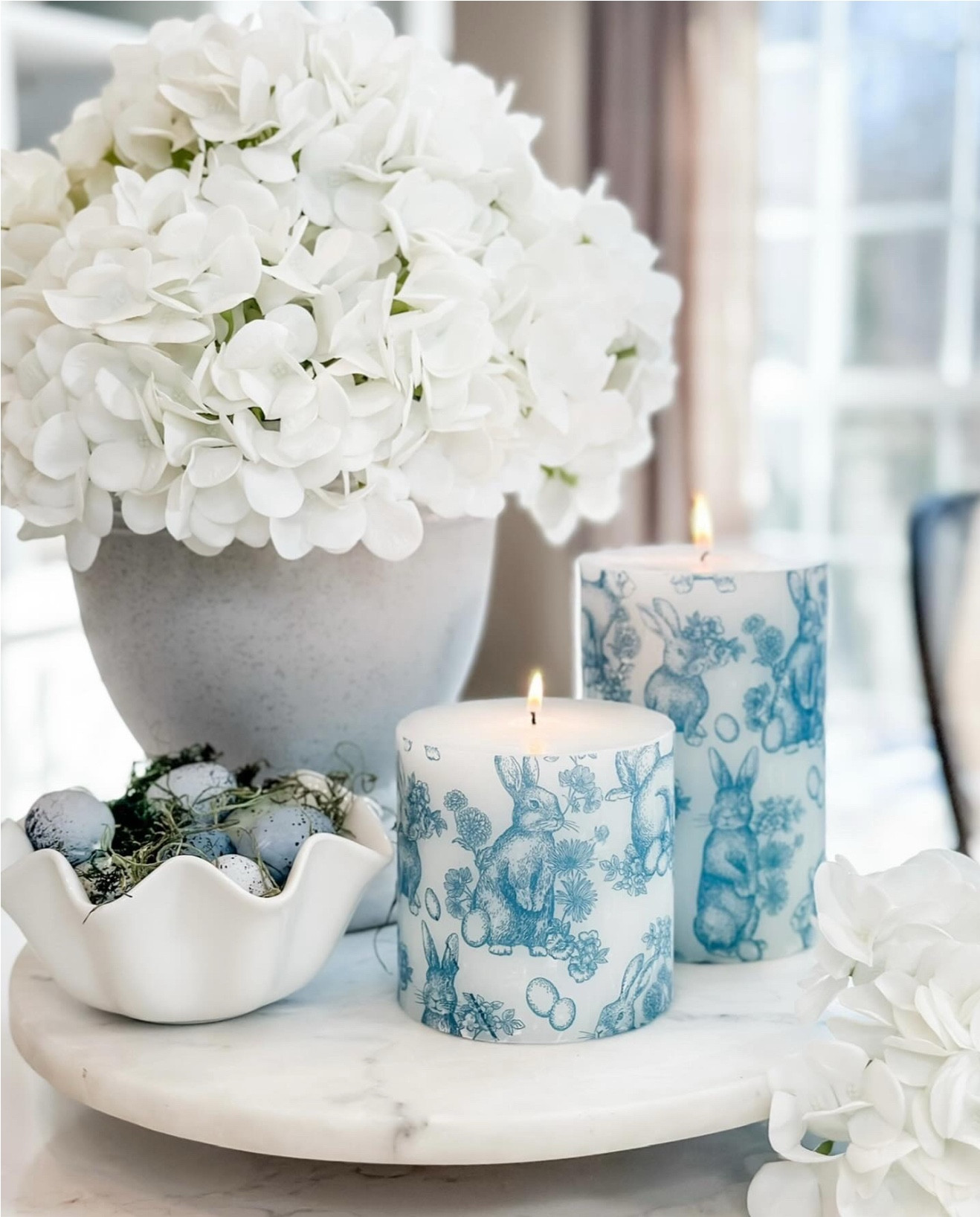 DIY Decoupage Napkin Candle is one of my all-time favorite projects! 🕯️💙Turn any ordinary candle into an exquisite work of art with this simple technique. I chose a toile bunny print for Easter, but you can pick any design for birthdays, celebrations, or seasonal decor. Peel, cut, wrap, cover with parchment paper, and use a low-setting iron to meld the print into the wax. Your custom candle now exudes charm with a seamlessly integrated design. 

TIPS:
* Quality Napkins: Choose durable, vibrant napkins for better results.
* Smooth Surface: Ensure the candle has a smooth surface for adherence.
* Even Ironing: Apply even pressure with a low-setting iron to prevent scorching.
* Parchment Protection: Cover with parchment paper while ironing.
* Gentle Handling: Handle the printed napkin delicately to avoid damage.


#LTKStyleTip #LTKSeasonal #LTKHome
