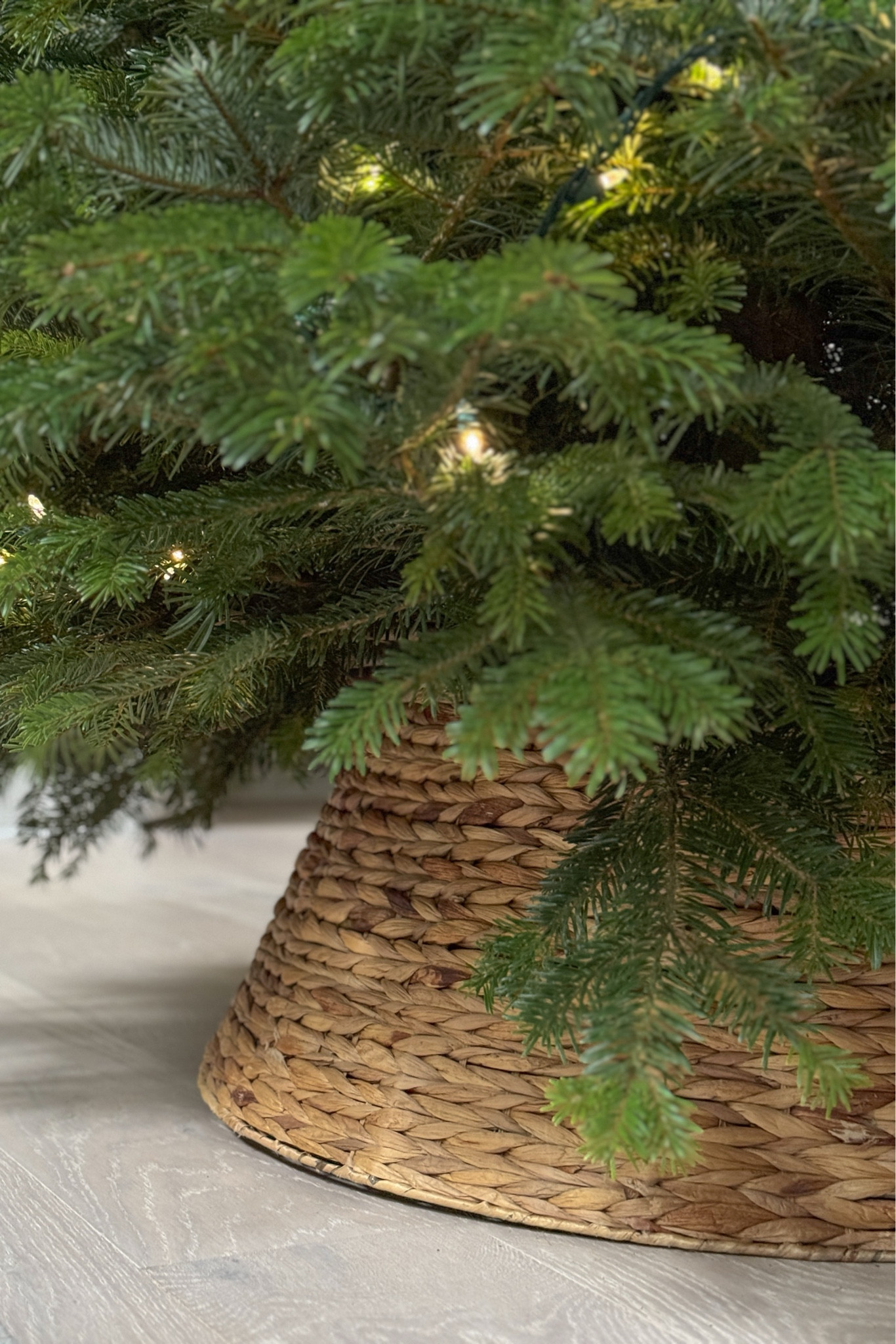 I adore this woven tree collar that I bought from Balsam Hill years ago! I personally prefer it to a tree skirt. 
*We have the Large size in color Light Brown.
I can’t link directly to the exact item, but I’ve included some very similar options!

#LTKHome #LTKHoliday