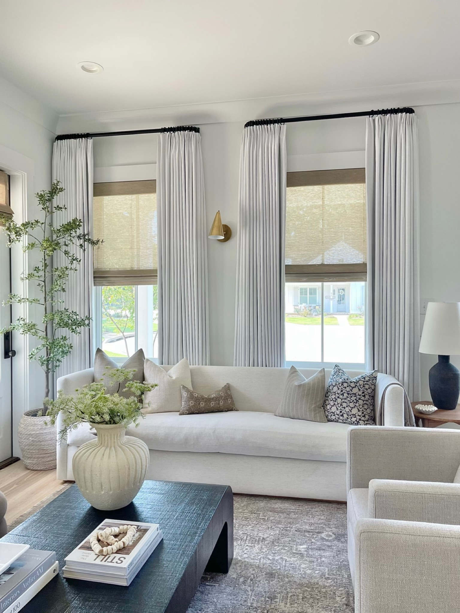 My Reese curved sofa is on sale for the mcgeeandco Labor Day sale at 25% off!
I covered mine in Crypton / Alabaster 

Home decor.  Living room decor,  living room
Sofa.  White sofa.  Cream sofa.  White linen curtains.  Black coffee table.  Living room rug.  Black olive tree.  Brass sconce.  Black lamp  

#LTKhome #LTKsalealert #LTKFind