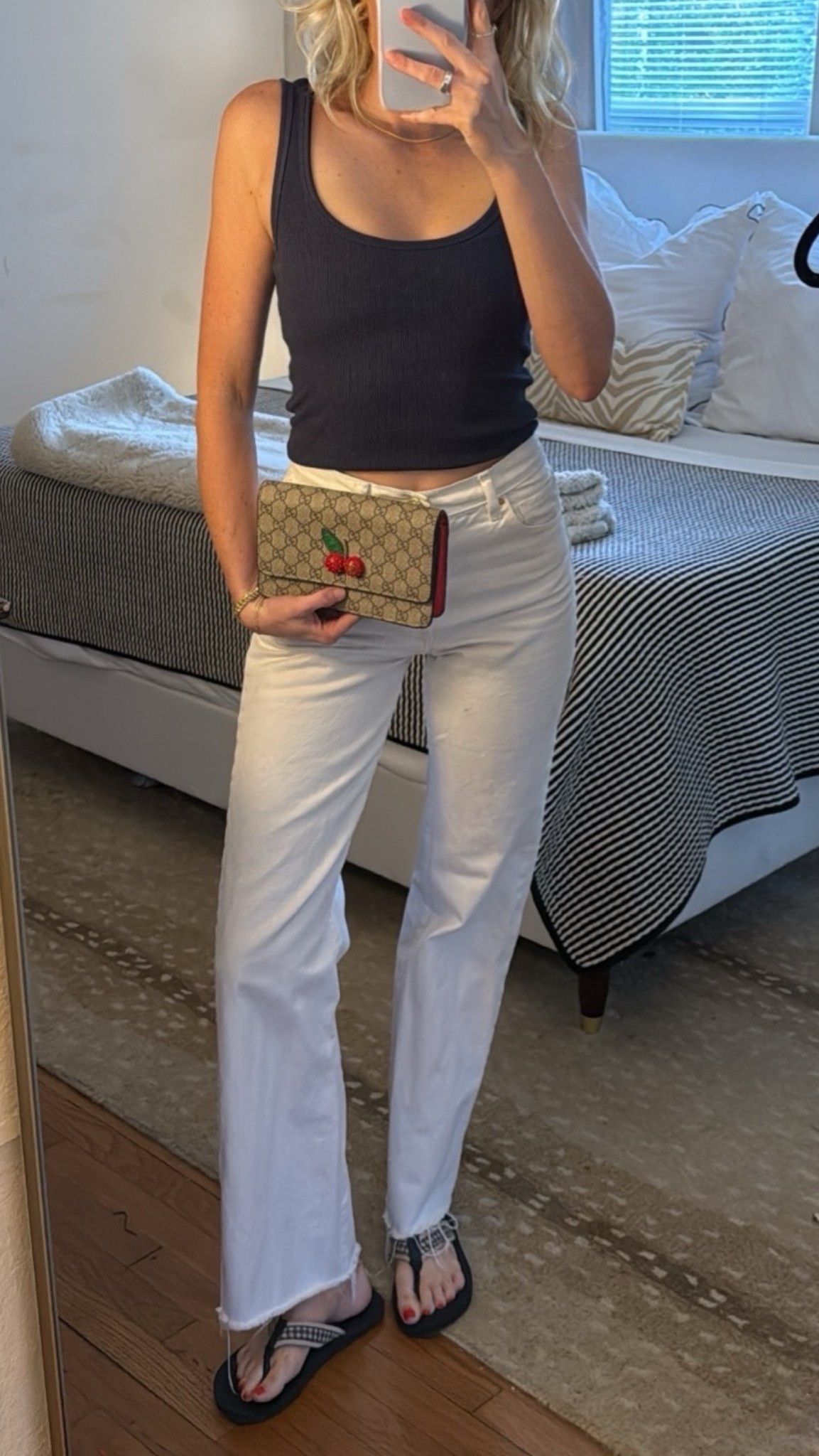 Effortless summer uniform 🤍 White jeans + a navy tank will never fail, and the cherry bag adds the perfect playful pop. Easy, classic, and on repeat all season.