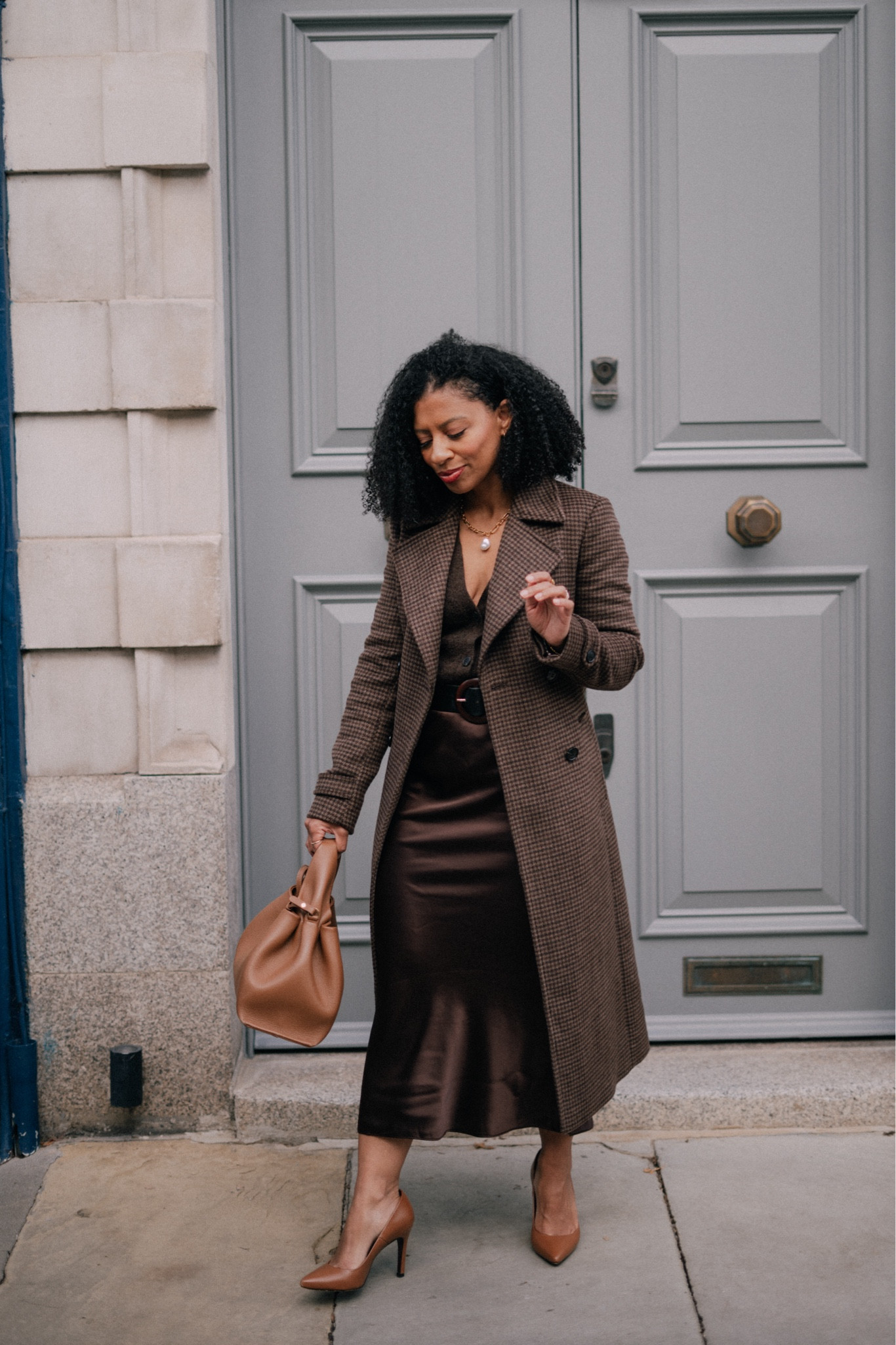 Chocolate brown Autumn Outfit, consisting of brown satin midi skirt, brown cardigan and brown winter coat. 

#LTKeurope #LTKSeasonal #LTKstyletip