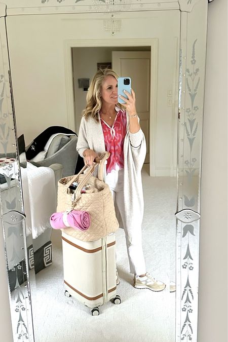 Travel style
Mersea Lightweight but cozy long cardigan sweater 
The most comfortable and flattering white jeans 
Paired with a colorful shirt in French top and my favorite Veronica Beard sneakers 
My holy grail, travel set includes the MZ Wallace deluxe metro tote and the Paravel aviator plus carry-on 
For more packing tips, go to Aliciawoodlifestyle.com and search packing!

#LTKSeasonal #LTKstyletip #LTKover40