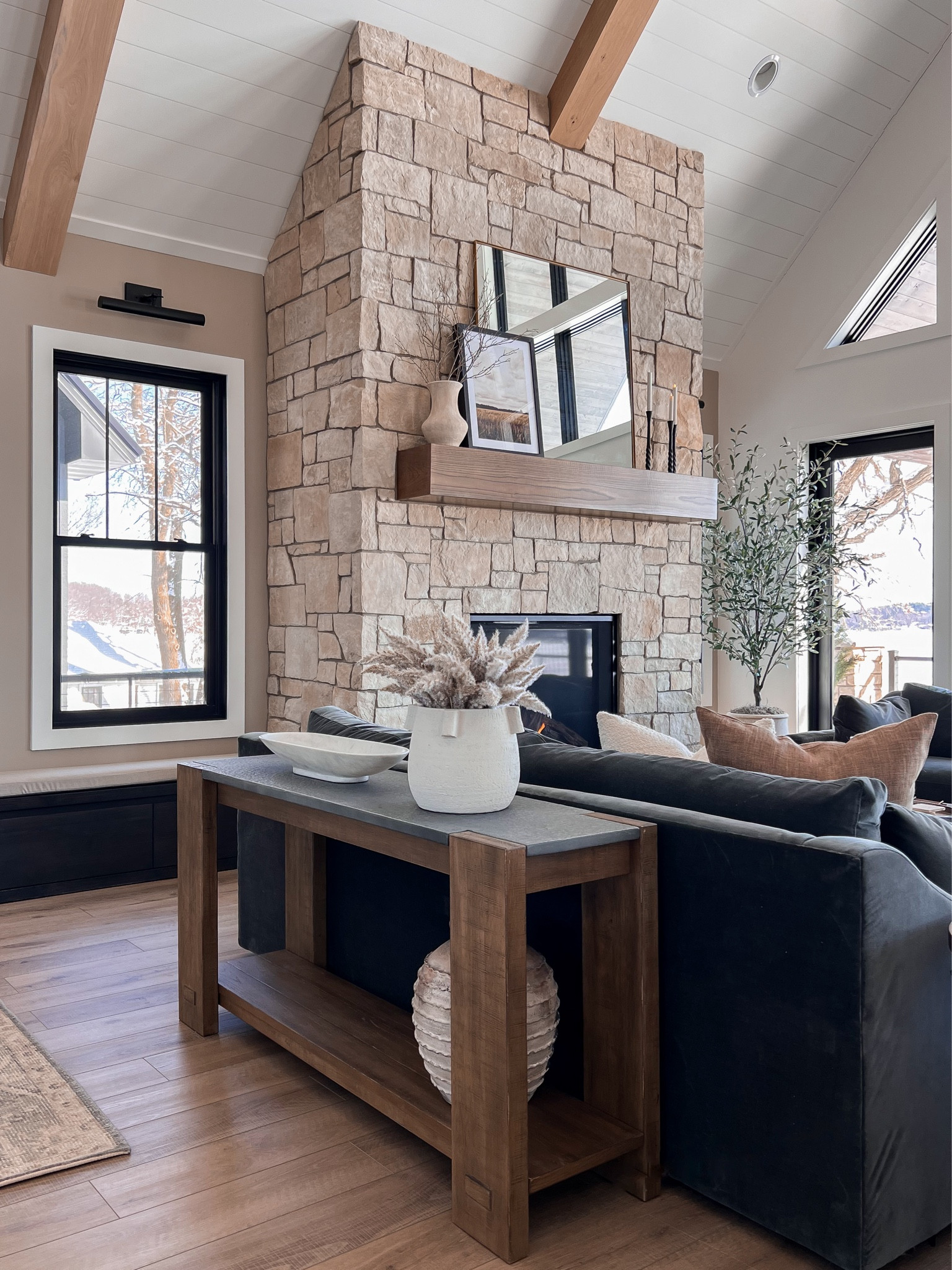 Our entryway is open to our family room so we used a console behind the couch to define each space. We also added a bench under the window with shoe storage below. 

#LTKstyletip #LTKhome