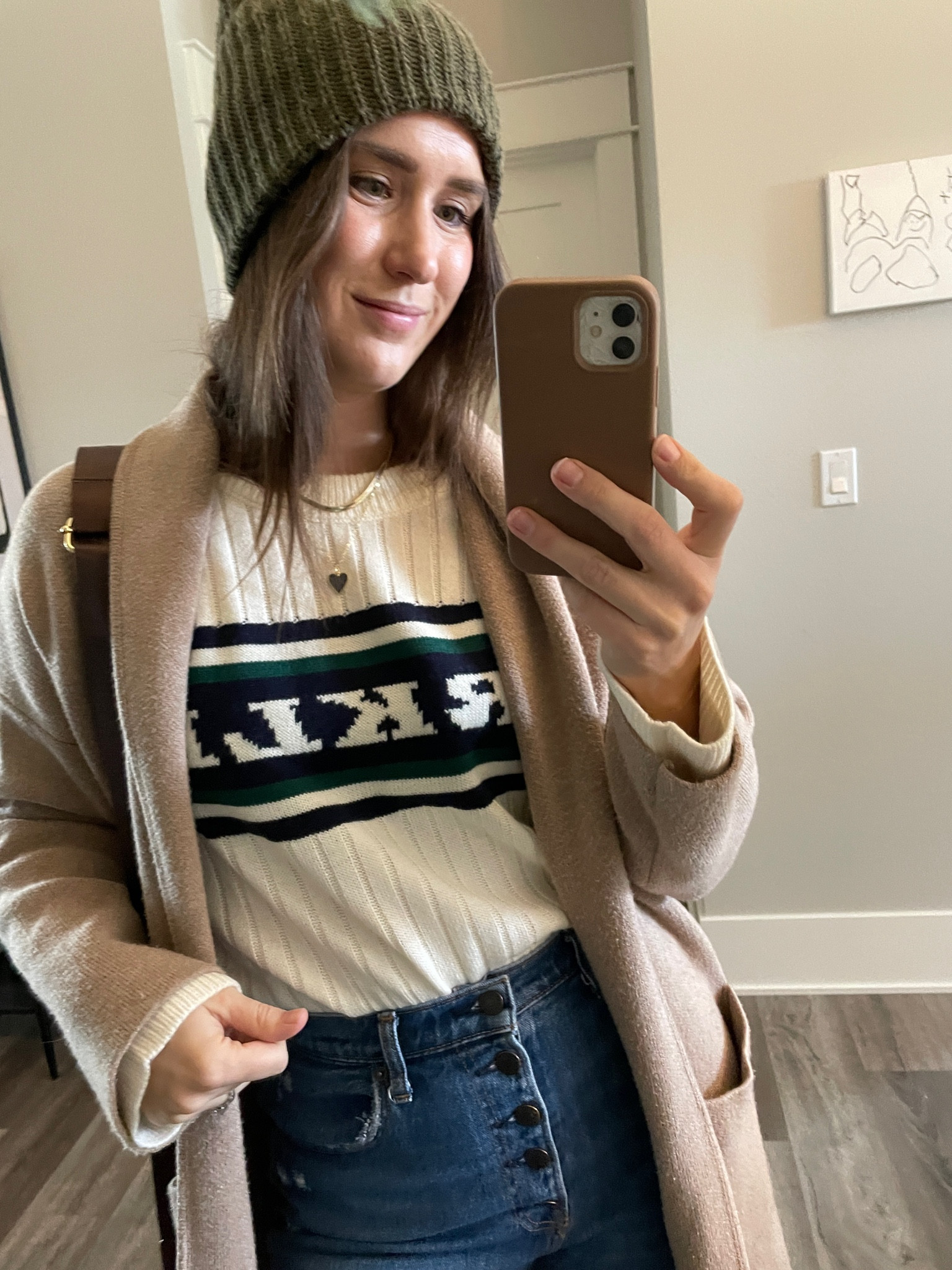 Under $30 sweater - I love how the graphic makes it feel different & edgy. I sized up one for a larger fit. #winteroutfit #sweater #casual 

#LTKstyletip #LTKfindsunder50 #LTKSeasonal