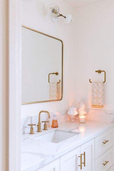 What Types of Fixtures Should I Use In My White and Gold Modern Small Bathroom Remodel?

Are you looking to add a touch of modern glamour to your small bathroom? Start by adding gold-finished faucets and handles for a stylish and modern look. Wall-mounted lighting fixtures in gold and white offer a bright and modern look and can be easily adjusted to create the perfect ambiance. Incorporate wall-mounted sconces and hanging chandeliers to brighten up the room and create a contemporary feel. Choose a white or gold-finished vanity to add a touch of glamour to the room. Match the fixtures to the other accents in the room, such as the shower curtain, hardware or wall art, to create a cohesive look. A gold-framed mirror can add a touch of sophistication and shine. Finally, incorporate storage options that feature both open and closed shelving to maximize space. For an added statement piece, add a freestanding tub or a statement waterfall showerhead. With these easy updates, you can achieve a modern white and gold small bathroom remodel that will be the envy of your guests.

#LTKhome