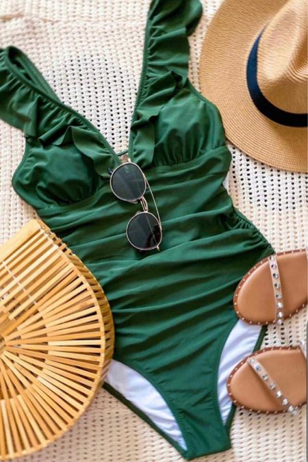 Vacation outfit 
One piece swimsuit - true to size - comfortable and comes in other colors 

Studded sandals 
Sunglassss 
Bamboo tote bag 
Sun hat 


#ltkshoecrush #ltkseasonal 

#LTKitbag #LTKover40 #LTKswim